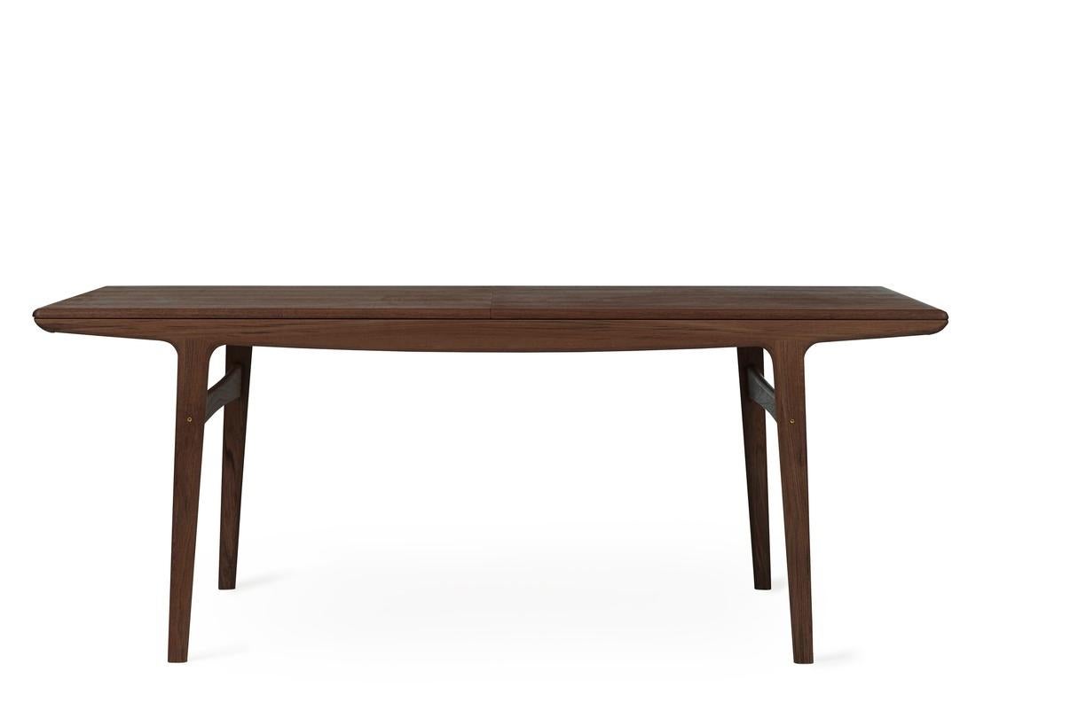Evermore dining table walnut 190 by Warm Nordic
Dimensions: D190 x W95 x H74 cm
Material: Oiled solid walnut and veneer
Weight: 51 kg
Also available in different colors and dimensions. 

A simple, timeless designer table created in the 1950s