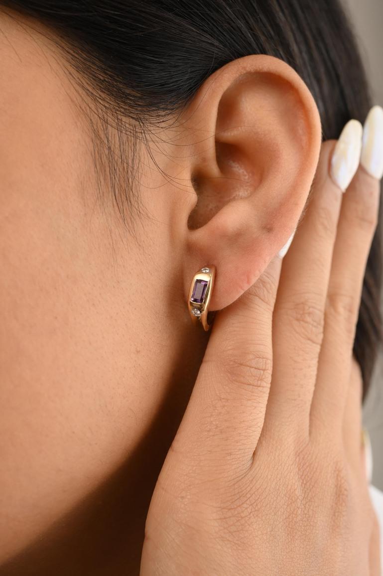 Everyday Amethyst Huggie Earrings in 14K Gold to make a statement with your look. You shall need stud earrings to make a statement with your look. These earrings create a sparkling, luxurious look featuring baguette cut amethyst.
Amethyst helps to