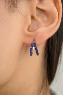 Everyday Deep Blue Sapphire Huggie Hoop Earrings for Women in 14k White Gold