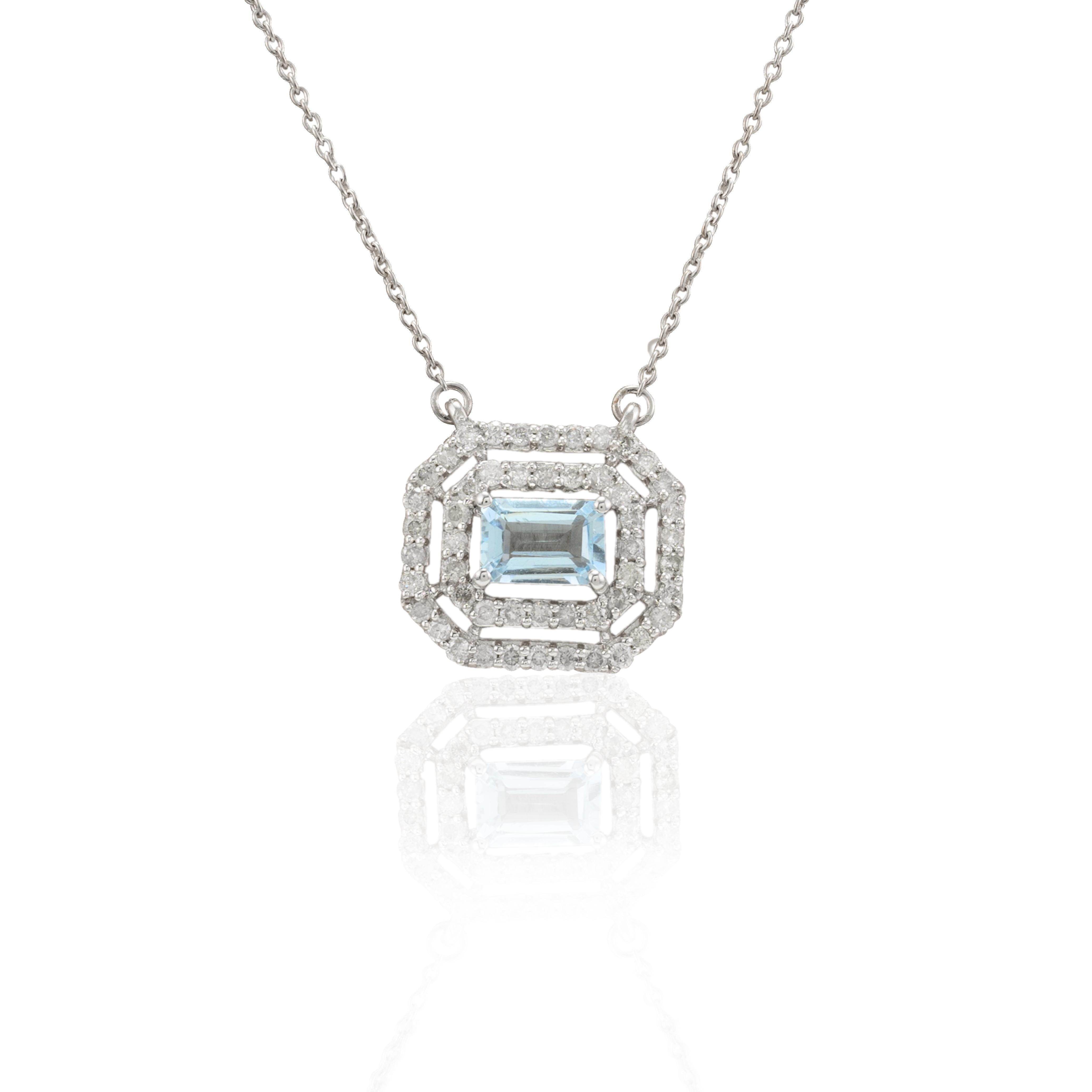Collier de chaîne en or 14 carats serti de diamants de taille octogonale en forme de halo d'aigue-marine. Ce superbe bijou rehausse instantanément un look décontracté ou une tenue habillée. 
L'aigue-marine est utile pour traverser les périodes de