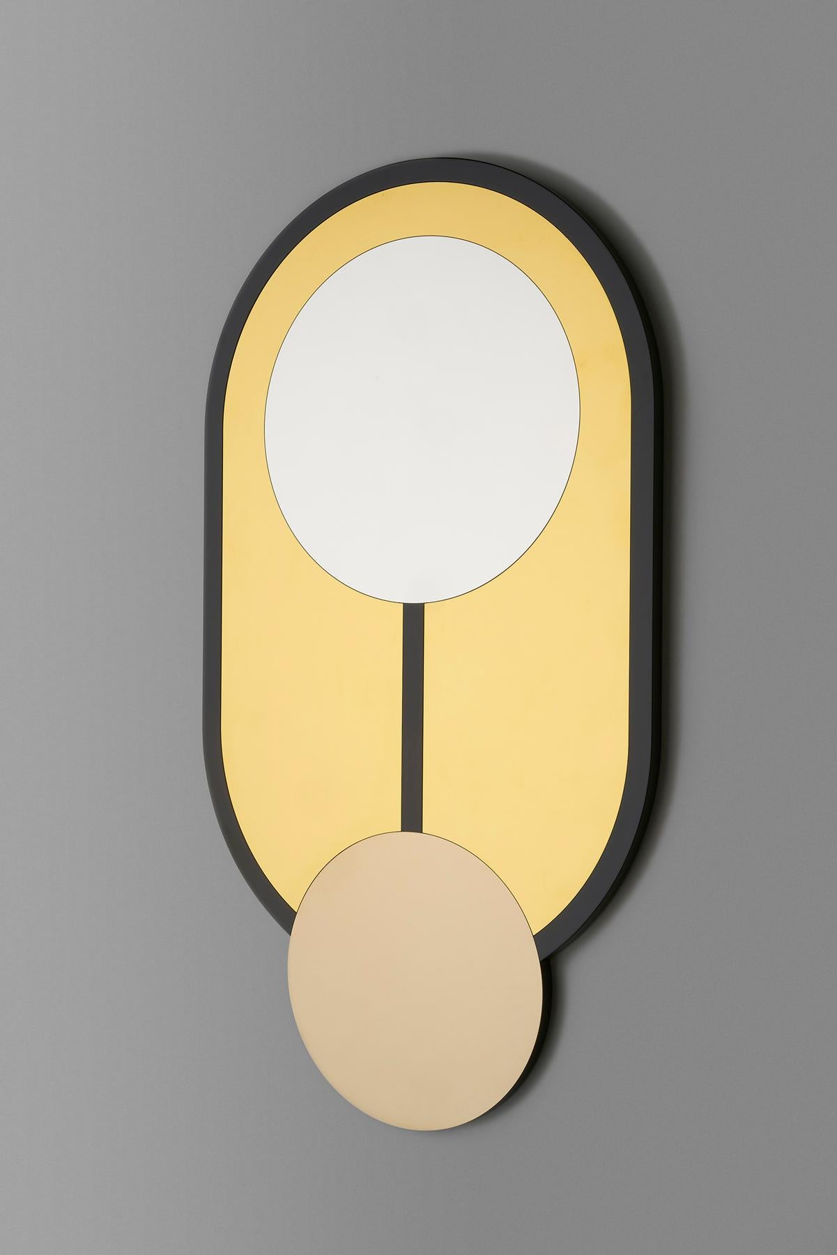 Circle and oval forms unite to create the graphic Everything is Golden mirror series. 

No. 2 features a black gloss lacquered frame inset with gold, silver and champagne mirrored stainless steel. 

A keyhole fixing to rear allows the mirror to