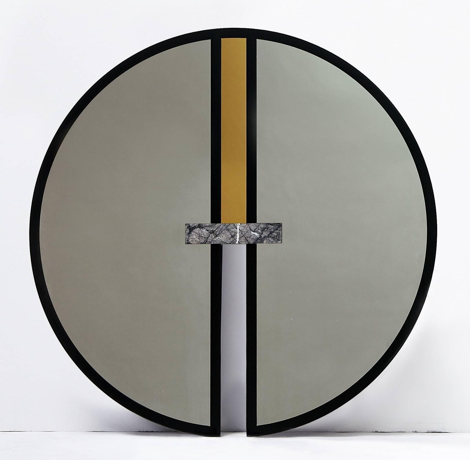 Circle and oval forms unite to create the graphic everything is golden mirror series. 

No. 6 is a circular mirror with a glossy black lacquered frame, inset with gold and silver mirrored stainless steel and Grigio Carnico marble. 
It also