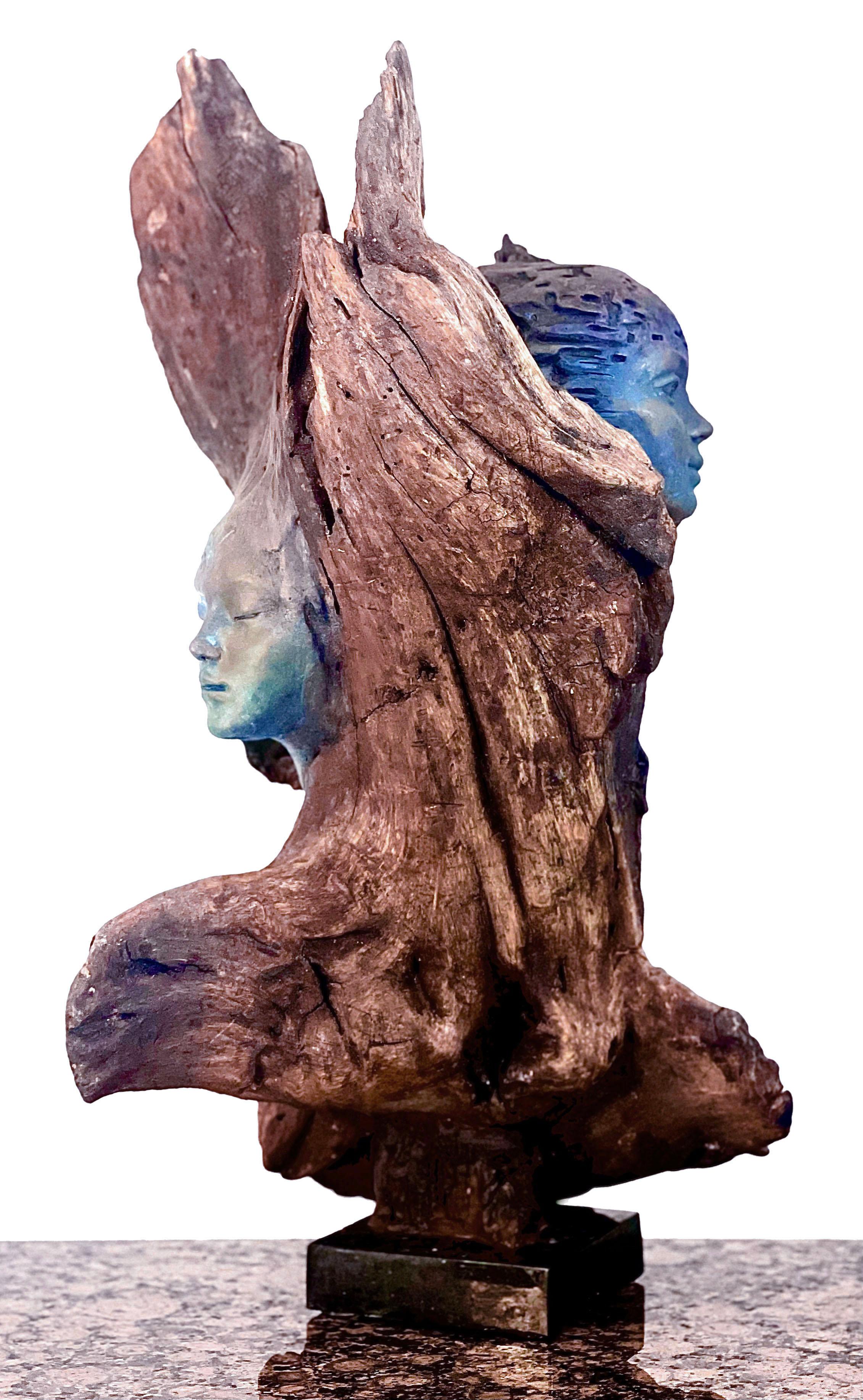 Contineo by Evgeni Vodenitcharov is an original wood sculpture was created in 2021 was inspired by the connection between humans and nature, manifesting the existential despair and emotions that this connection creates. Attempting to create from a