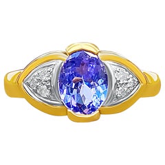 Anillo "Ojo maligno" de tanzanita y diamantes talla oval de 1,23 ct y oro amarillo de 14 quilates
