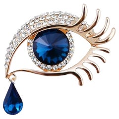 Spilla con goccia di cristallo blu e diamante con occhio maligno