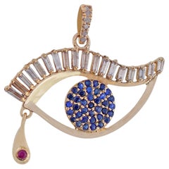 Pendentif de créateur « Evil Eye » avec diamant baguette blanc naturel et saphir bleu