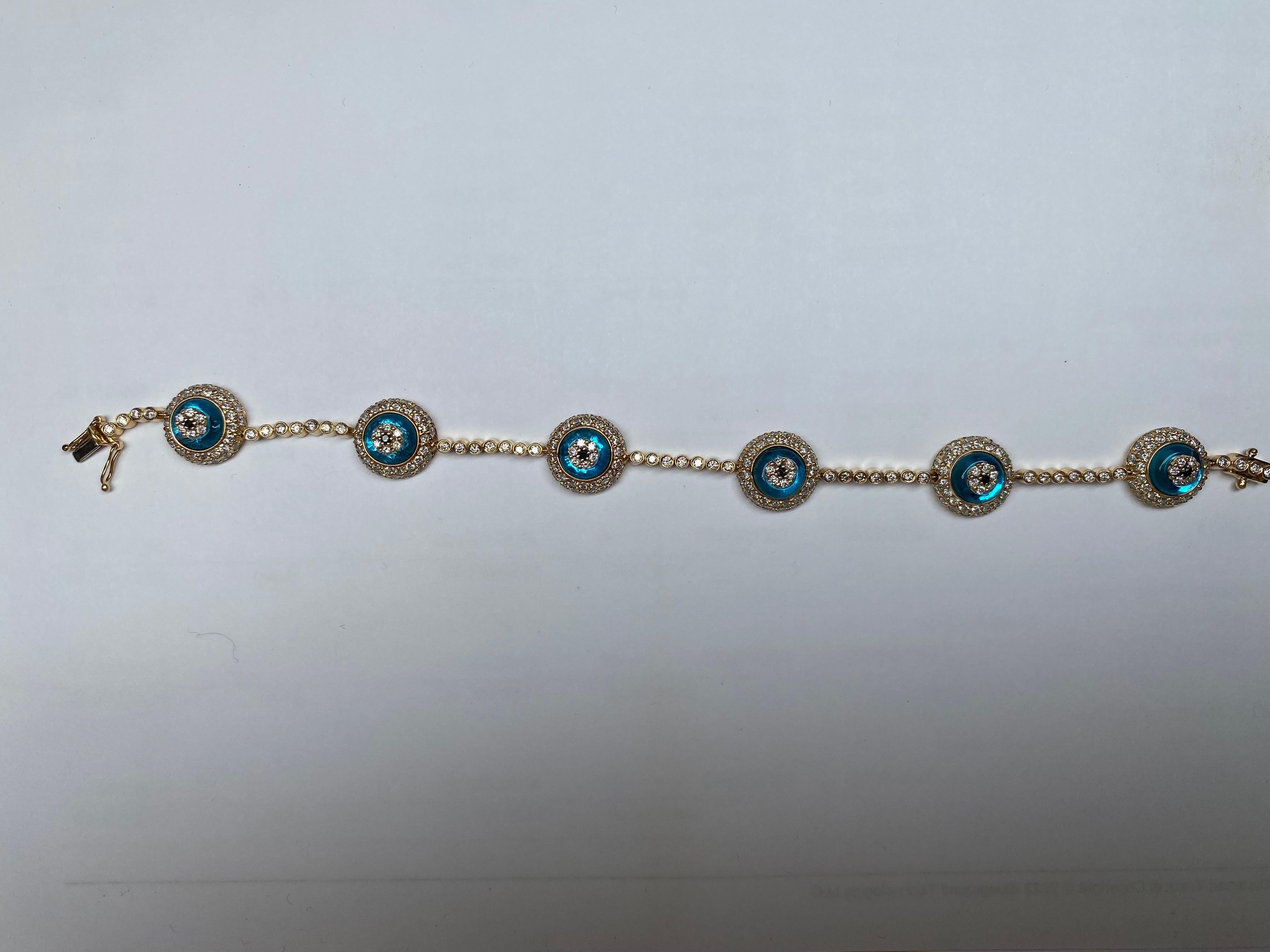 Handmade 18k Yellow Gold Evil Eye bracelet with 6 blue sapphires and round brilliant cut diamonds weighing a total of 4.28 carats. 21.85g

Viewings available in our NYC wholesale office by appointment only. 

Accredited appraisal from independent