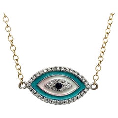 Evil Eye Diamond & Sapphire Pendant Set In 9ct White and Yellow Gold