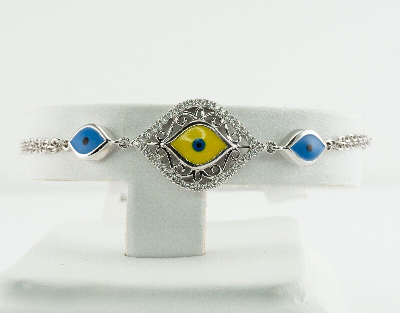 Evil Eye Enamel Diamond Bracelet 14K White Gold Brand NWT

This bracelet is a brand new with a $1930 tag. The bracelet is crafted in solid 14K White Gold. The center piece with yellow, blue, and black enamel and diamonds around it measures 20mm x