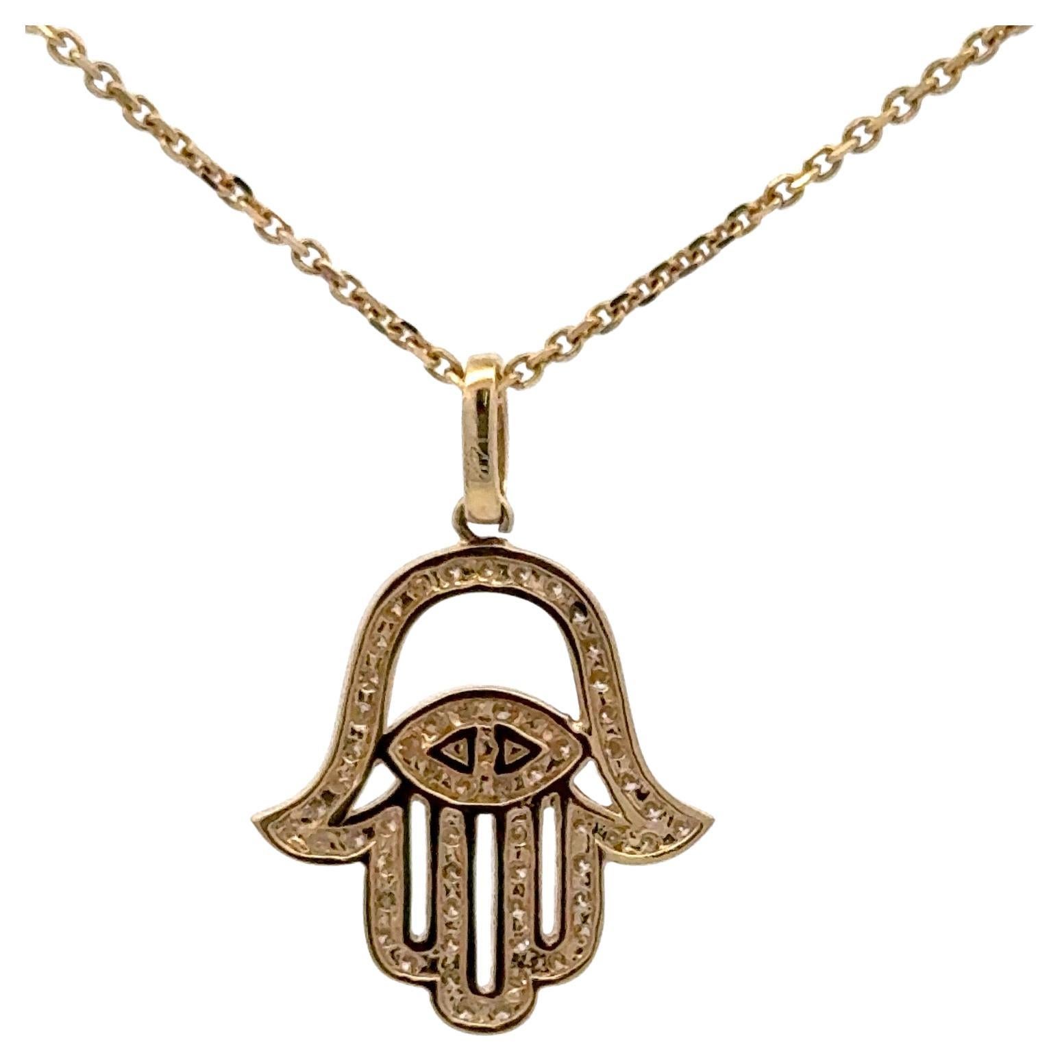 14 Karat yellow gold pendant necklace featuring a diamond Hamza design with an Evil Eye design weighing 0.62 carats. Color I Clarity VS2
Can order in any gold color. 

More Hamza & Evil Eye designs in stock.
Message for pictures & details.
Search