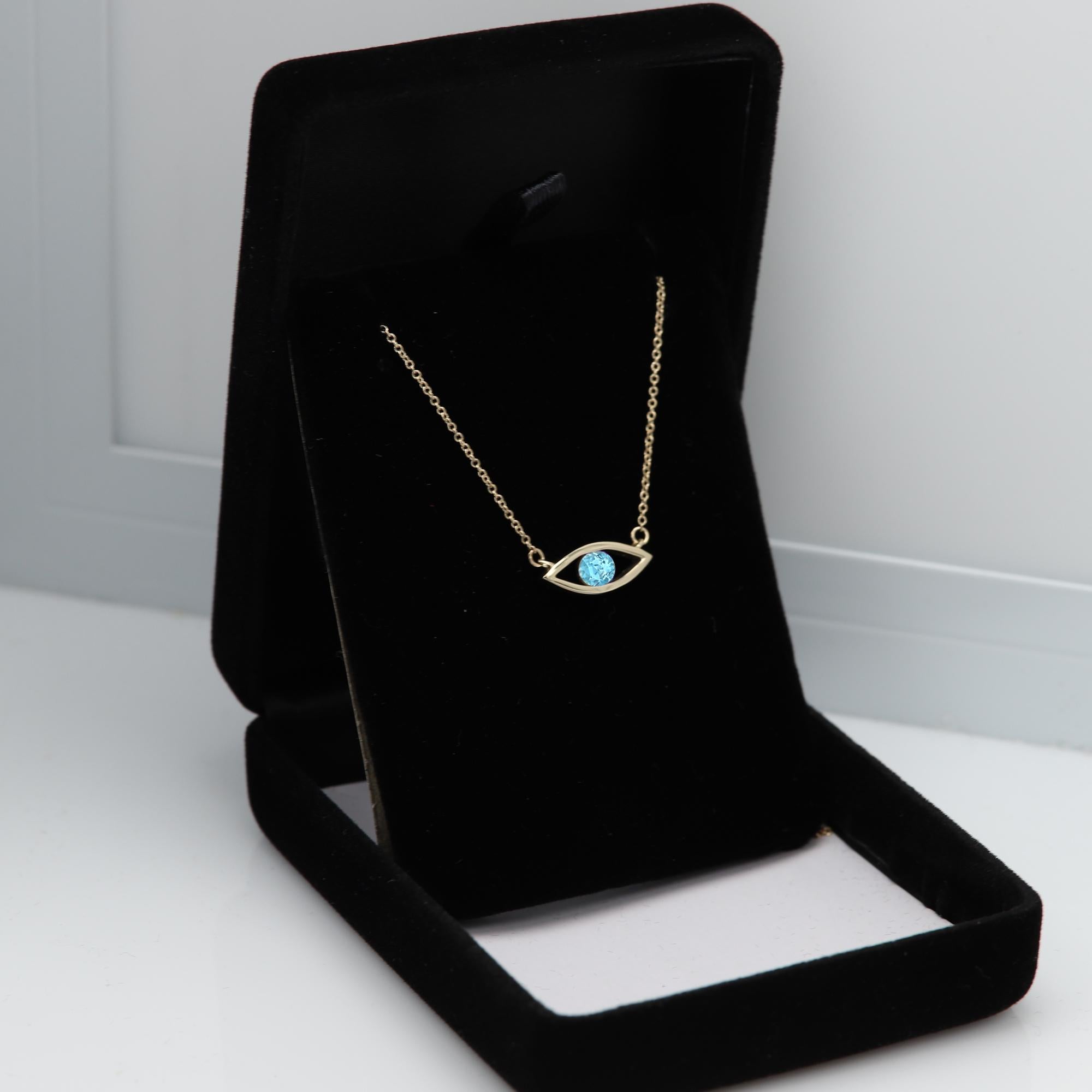 Women's Evil Eye Necklace 14 Karat Yellow Gold Blue Topaz Birthstone 0.50 Carat For Sale