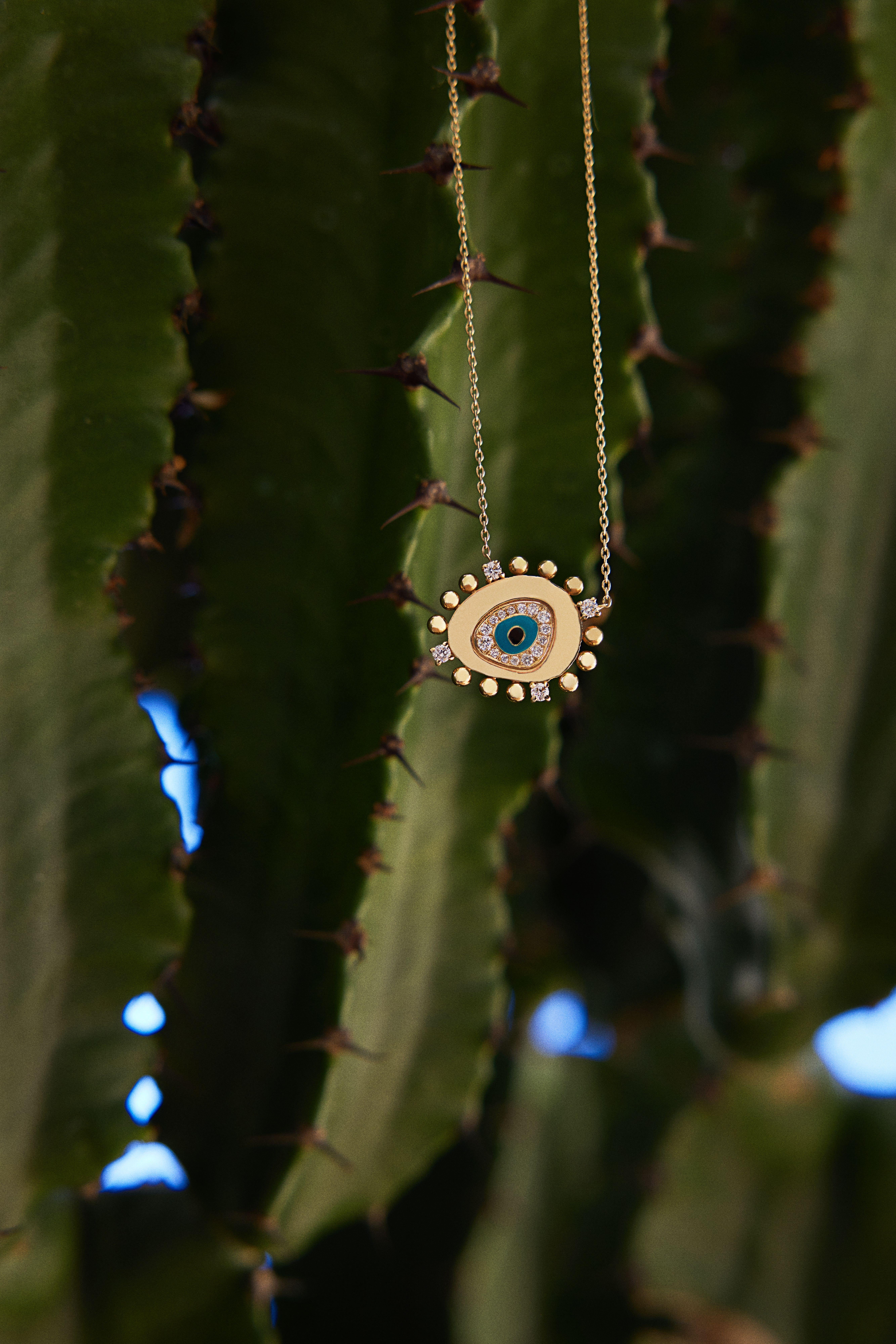 Moderne Collier Evil Eye en or 14 carats et diamants 0,25 carat en vente