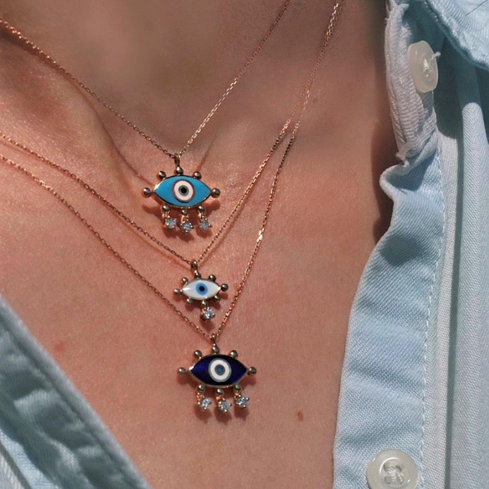 Evil eye necklace with navy blue enamel and white diamond by Selda Jewellery

Additional Information:-
Collection: Art of giving collection
14K Rose gold
0.08ct White diamond
Pendant height 1.5cm
Chain length 42cm