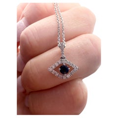 Evil eye pendant necklace 14KT white gold Natural sapphires and diamonds pendant