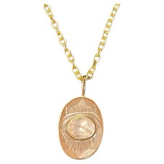 EVIL EYE Pendant, peach moonstone, rose quartz and 14k gold