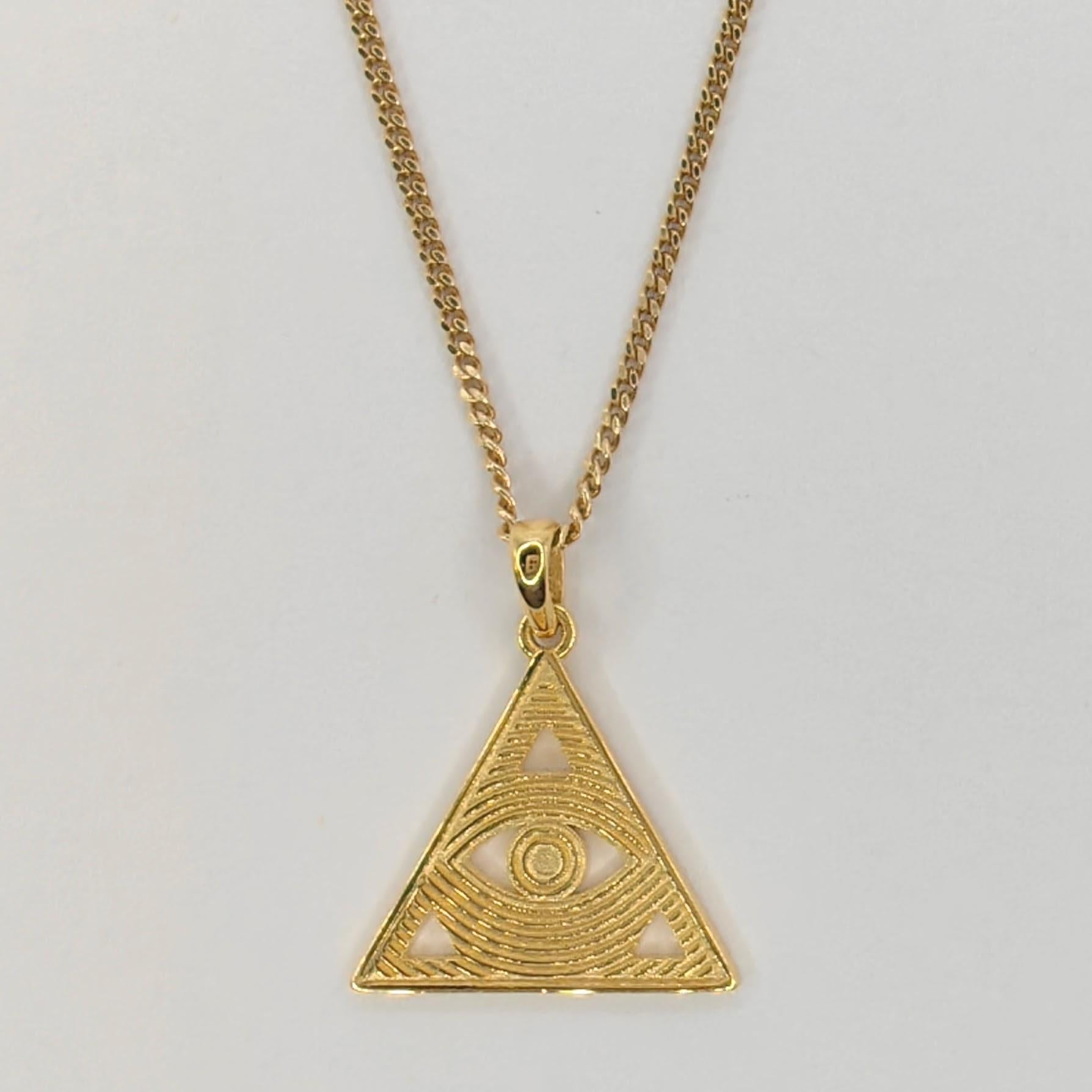 Introducing our Evil Eye Triangle Necklace Pendant, a captivating and symbolic piece that combines the powerful protective symbol of the Evil Eye with exquisite craftsmanship and a modern touch.

With dimensions of 19.9mm x 17.2mm, this pendant