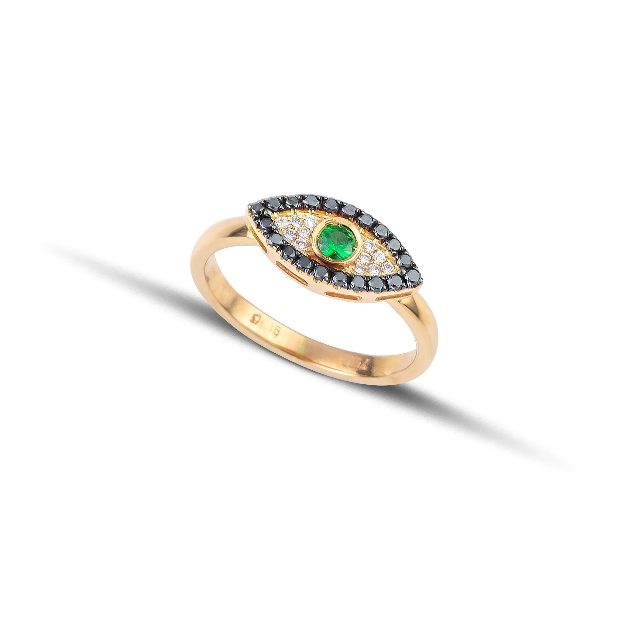 Evil Eye Ring with pave white and black brilliant cut diamonds and a central green Tsavorite, handcrafted in 18Kt yellow gold. In the greek culture the evil eye protects the one who wears it from the negative energy and stops the bad thoughts from