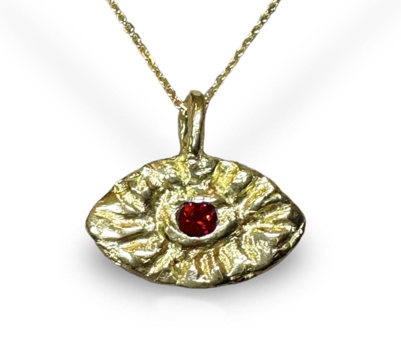 ne of a kind 18K Yellow Gold Eye Pendant designed for men.

The evil eye belief started in ancient Greece and Rome and it is one of the most popular and widely recognised symbols up until this date.  It is believed that it will protect the one who