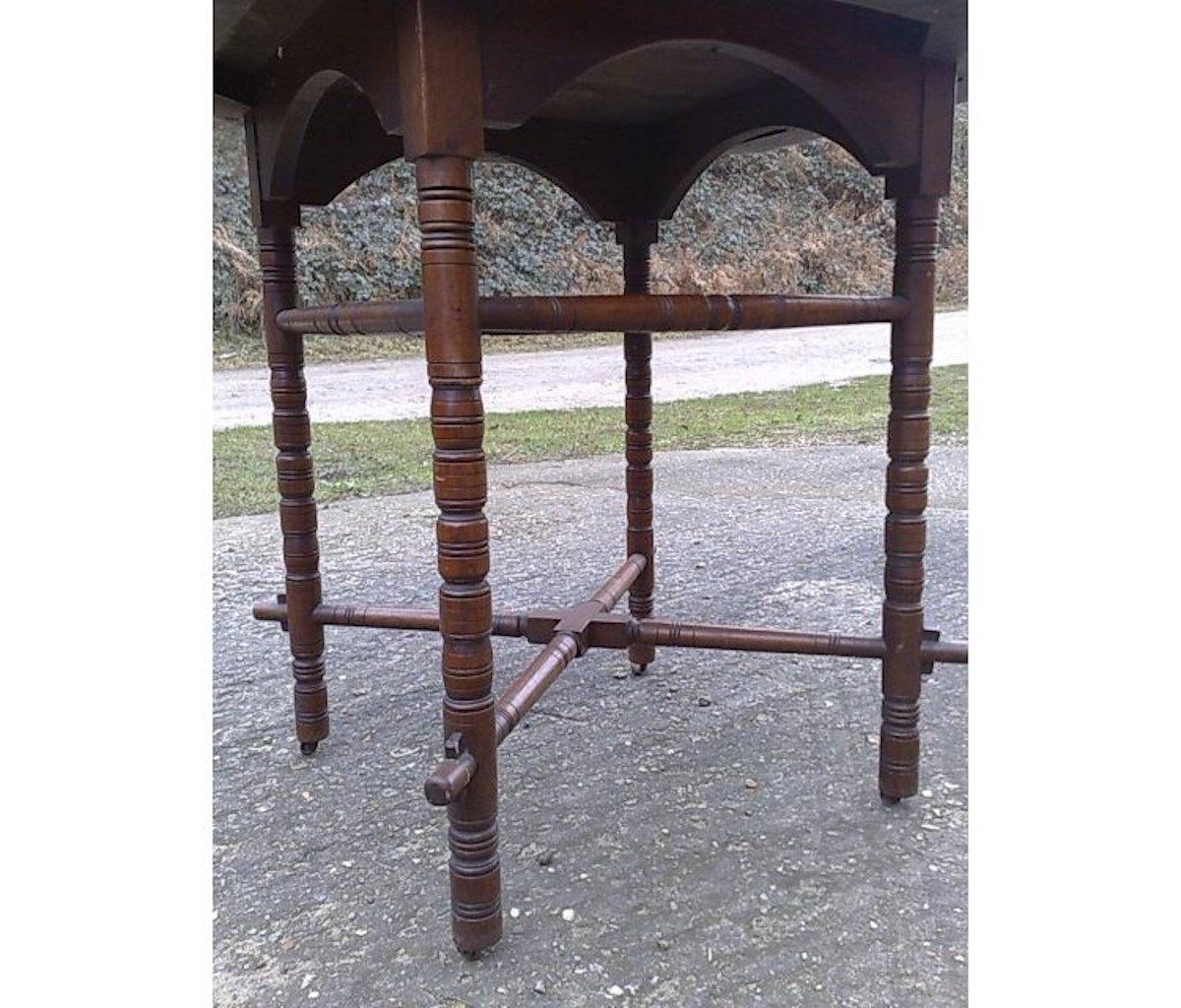 Hand-Crafted E.W. Godwin, an Aesthetic Movement Walnut Octagonal Table with Crossed Stretcher For Sale