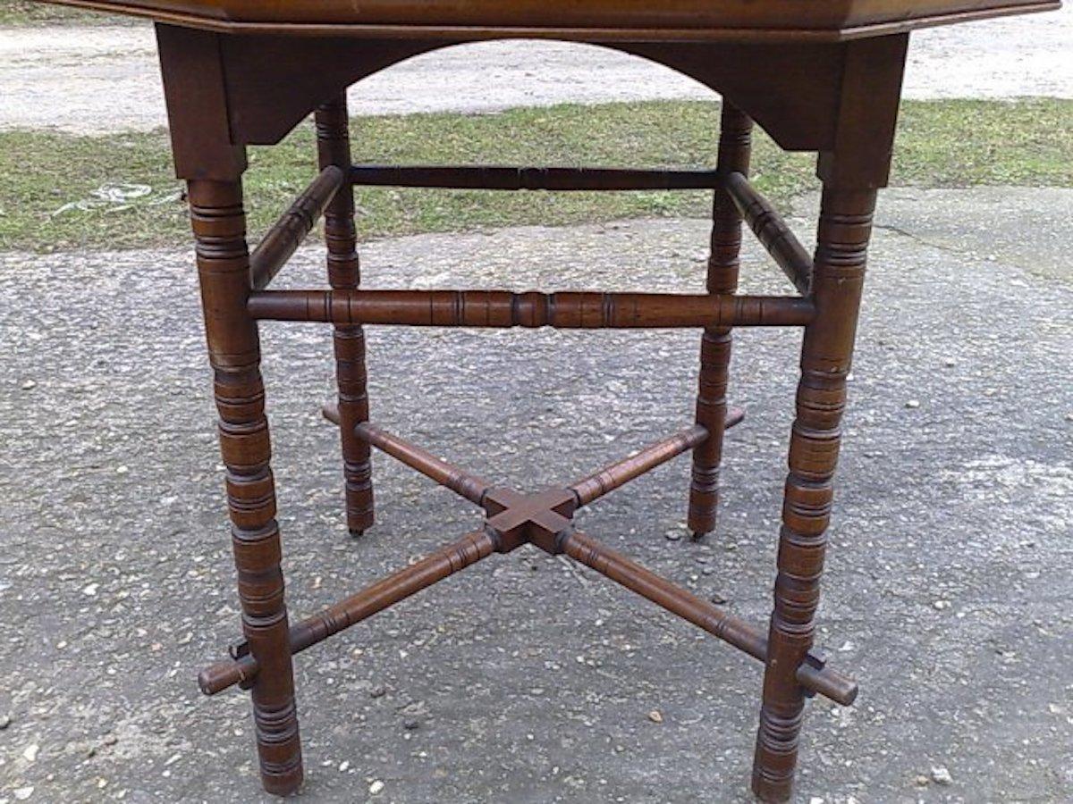 E.W. Godwin, an Aesthetic Movement Walnut Octagonal Table with Crossed Stretcher In Good Condition For Sale In London, GB