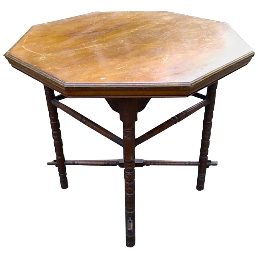 E.W. Godwin, an Aesthetic Movement Walnut Octagonal Table with Crossed Stretcher For Sale