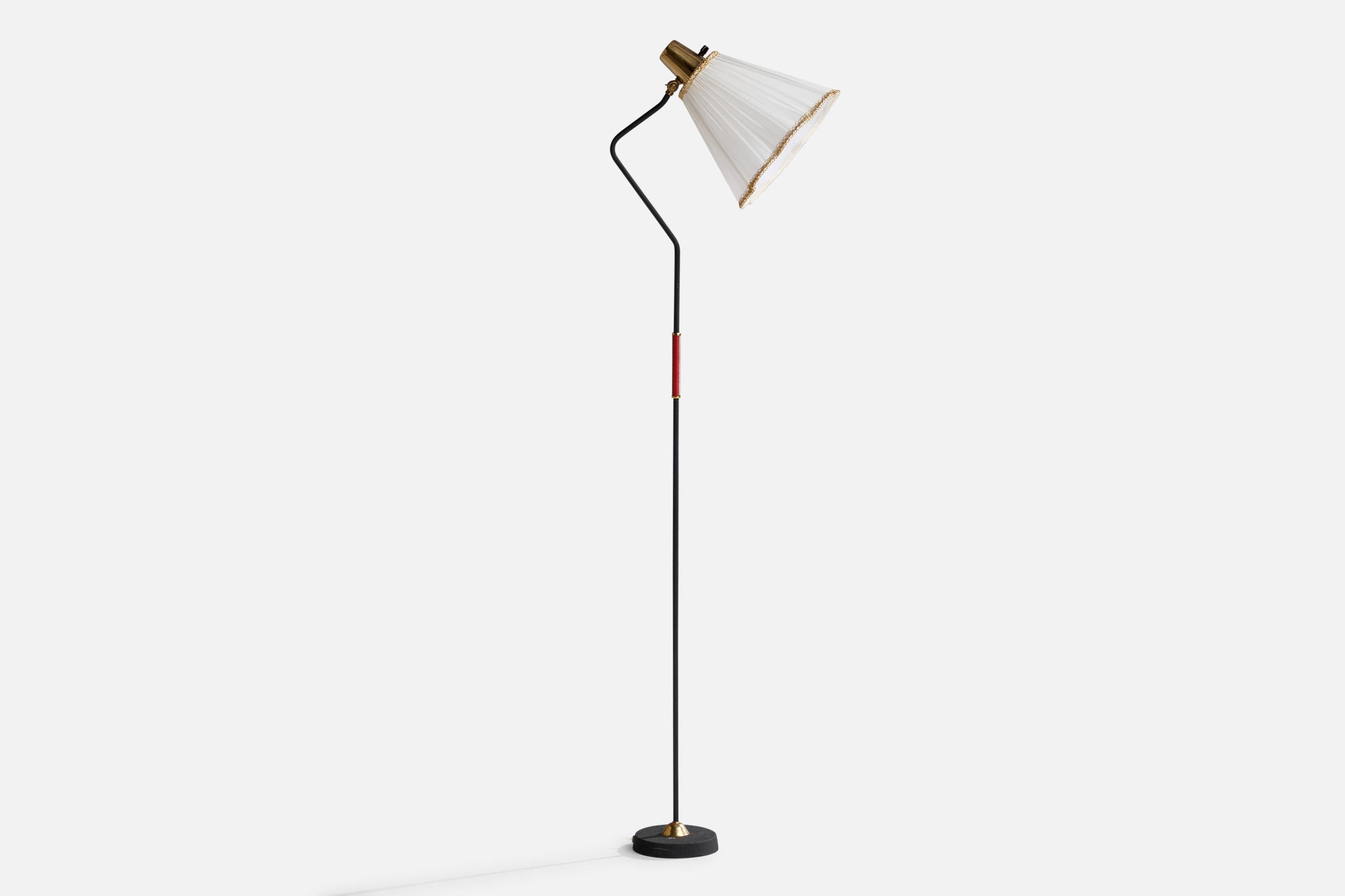 A black-lacquered metal, brass, red plastic band and white fabric floor lamp designed and produced by EWÅ Värnamo, Sweden, 1950s.

Overall Dimensions (inches): 52.5”  H x 9.25” W x 15”  D
Stated dimensions include shade.
Bulb Specifications: E-26