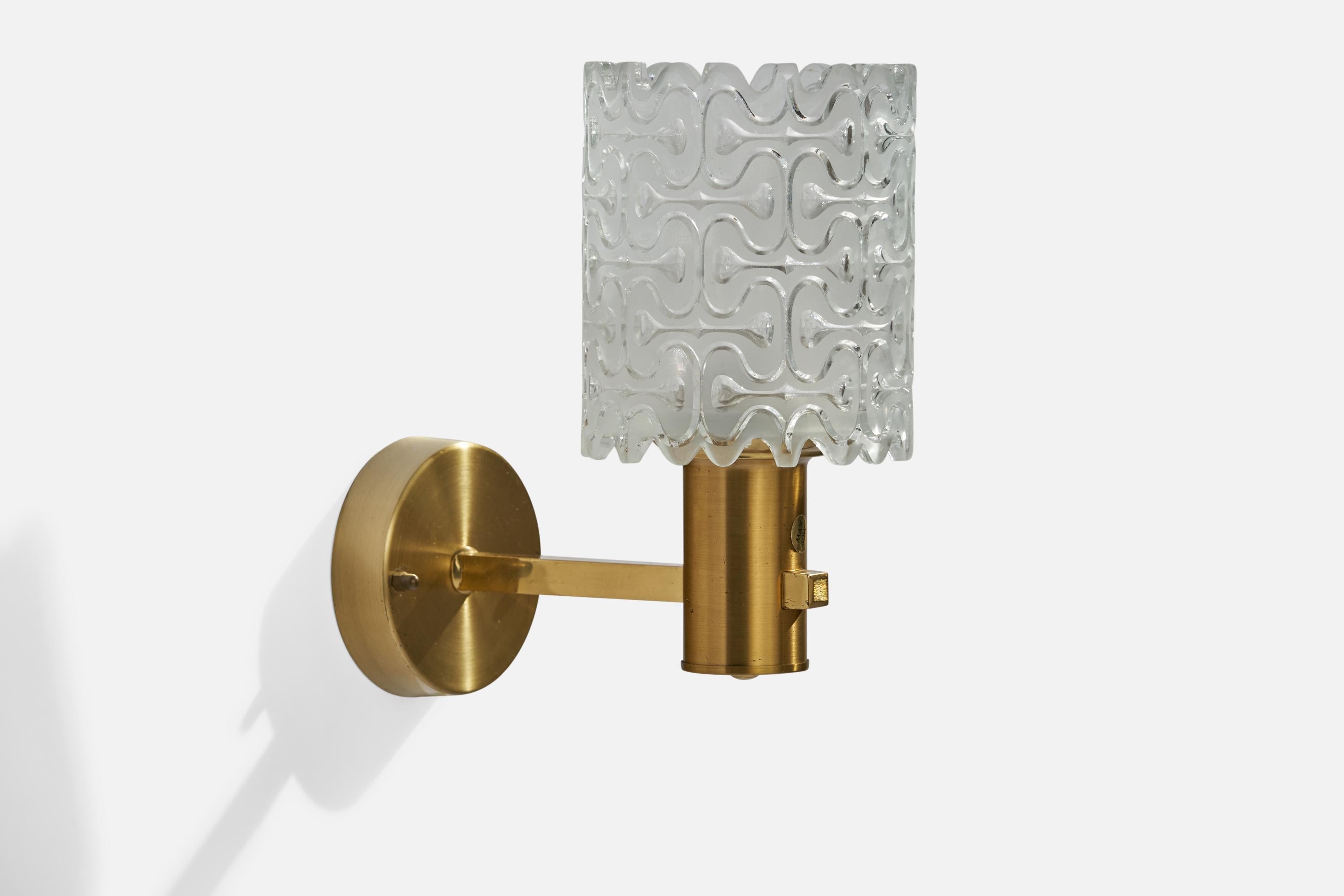 A brass and glass wall light designed and produced by EWÅ Värnamo, Sweden, c. 1960s.

Overall Dimensions (inches): 9” H x 4.25” W x 8”  D
Back Plate Dimensions (inches): 3.5”  H x 3.5” W x .75” D
Bulb Specifications: E-26 Bulb
Number of Sockets: