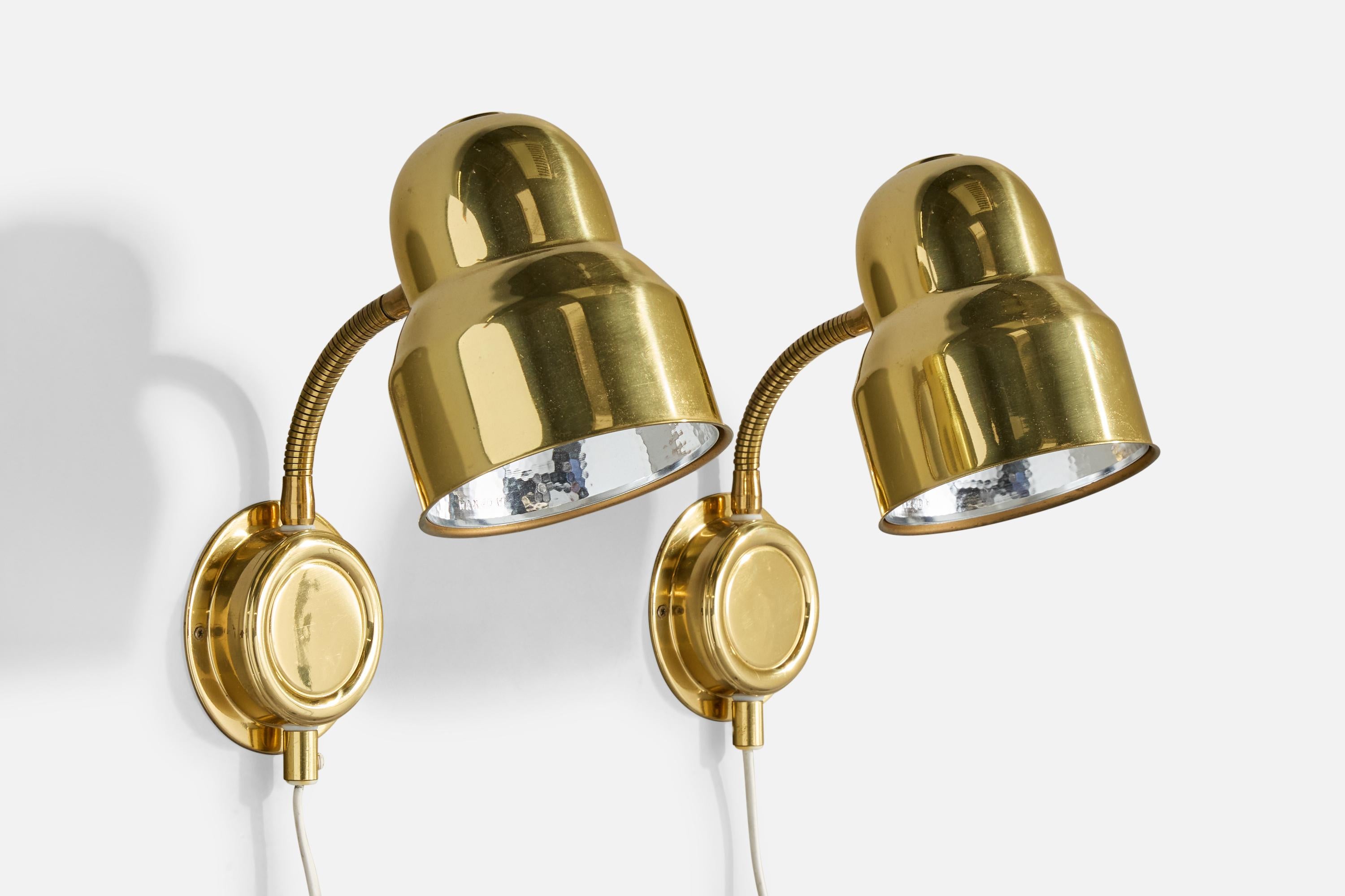 A pair of adjustable brass and metal wall lights designed and produced in Sweden, c. 1970s.

Overall Dimensions (Inches): 11.5” H x 5.125” W x 9.75“ D (measured as shown).

Back Plate Dimensions (Inches): 4.25” H x 4.25“ W x 1.15” D

Bulb