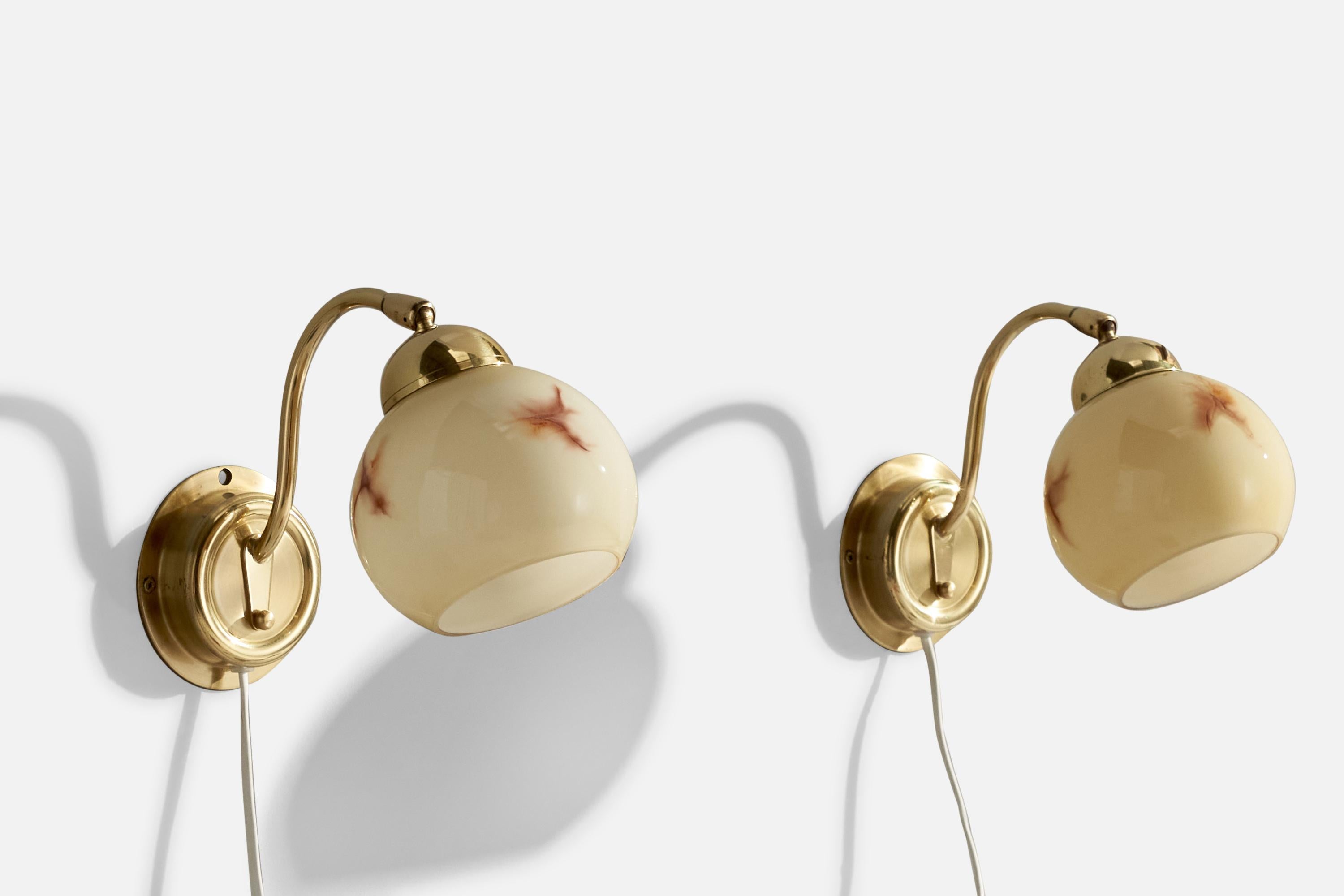  A pair of brass and beige opaline glass wall lights produced by EWÅ Värnamo, Sweden, 1970s.

Shade is Adjustable (Up and Down)

Overall Dimensions (inches):  7.25” H x  4.75” W x  9.25“D
Back Plate Dimensions (Inches):  4.25” Diameter x 1” D
Bulb