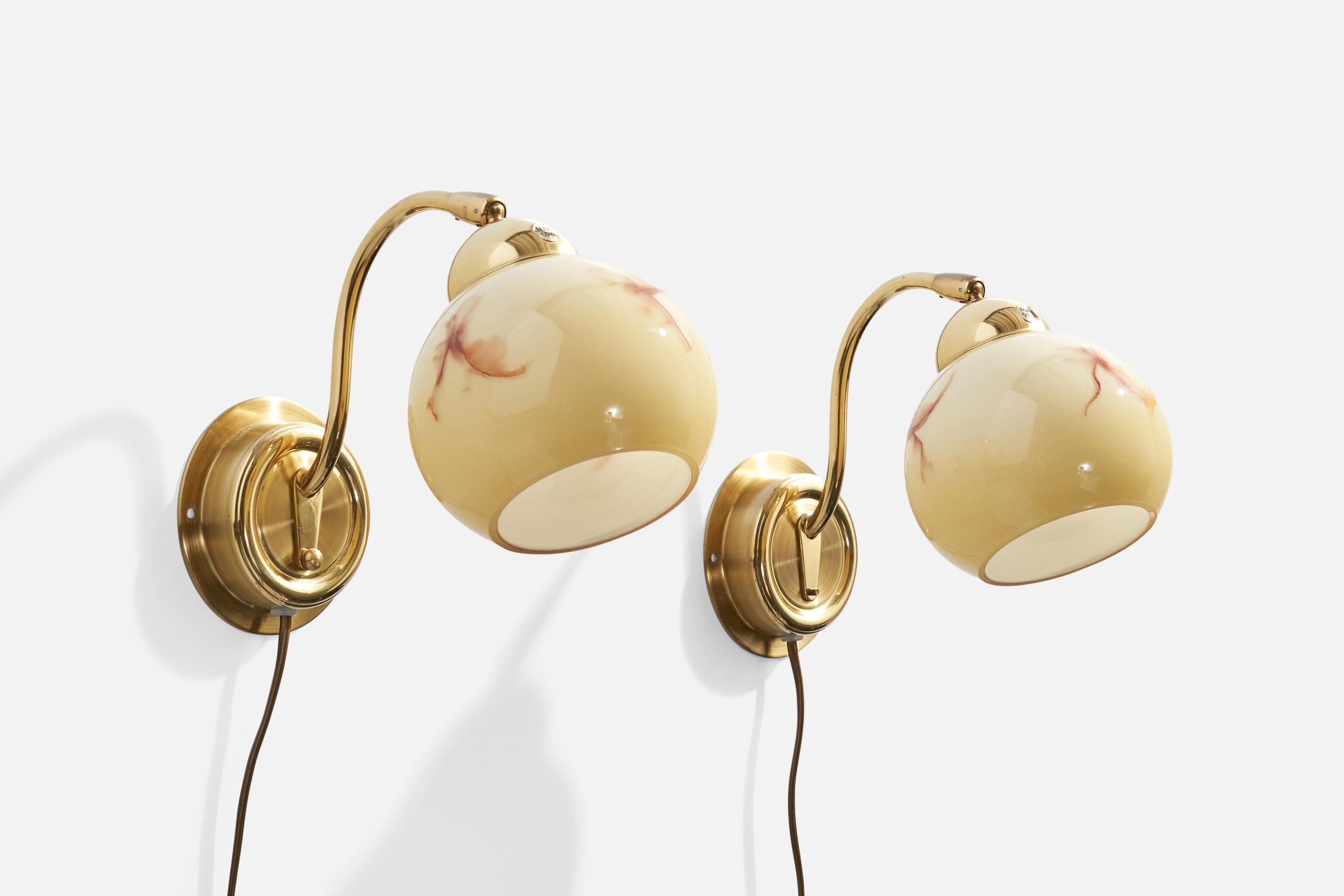 A pair of brass and glass wall lights produced by EWÅ Värnamo, Sweden, c. 1970s.

Overall Dimensions (inches):  7.25” H x  5” W x  9.25” D

Back Plate Dimensions (Inches):  4.25” H x 4.25” W x 1.1” D

Bulb Specifications: E-26

Number of Sockets