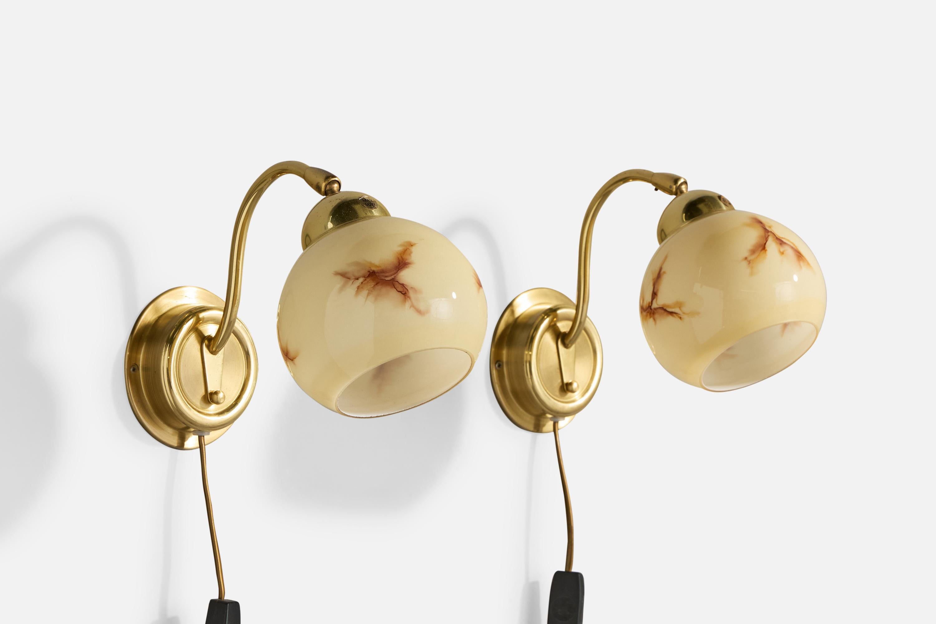 A pair of brass and glass wall lights produced by EWÅ Värnamo, Sweden, c. 1970s.

Overall Dimensions (Inches): 7.25” H x 5.25” W x 8“ D

Back Plate Dimensions (Inches): 4.25” H x 4.25“ W x 1” D

Bulb Specifications: E-26

Number of Sockets (per