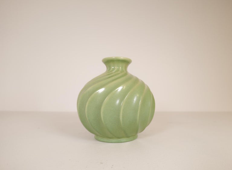 Ewald Dahlskog for Bo Fajans, large Swedish ceramic vase with swirls of light green ice cream.
A wonderful object with very nice lines and glaze. Made in the 1930s at BoFajans.

Good vintage condition with a drilled hole in the bottom.