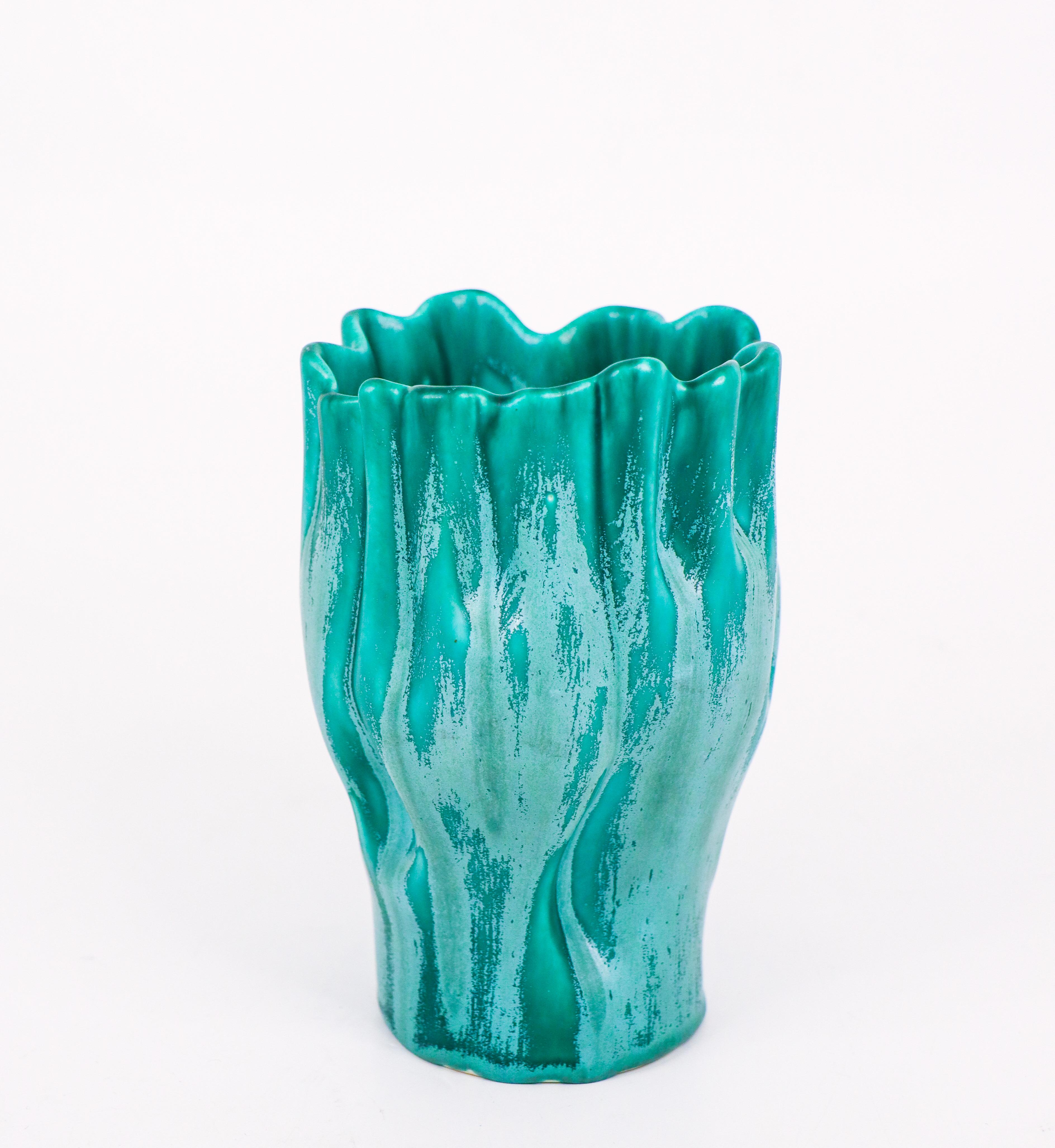 A lovely turquoise naturally shaped vase designed by Ewald Dahlskog at Bo Fajans, Sweden in the 1930s. The vase is 15 cm (6