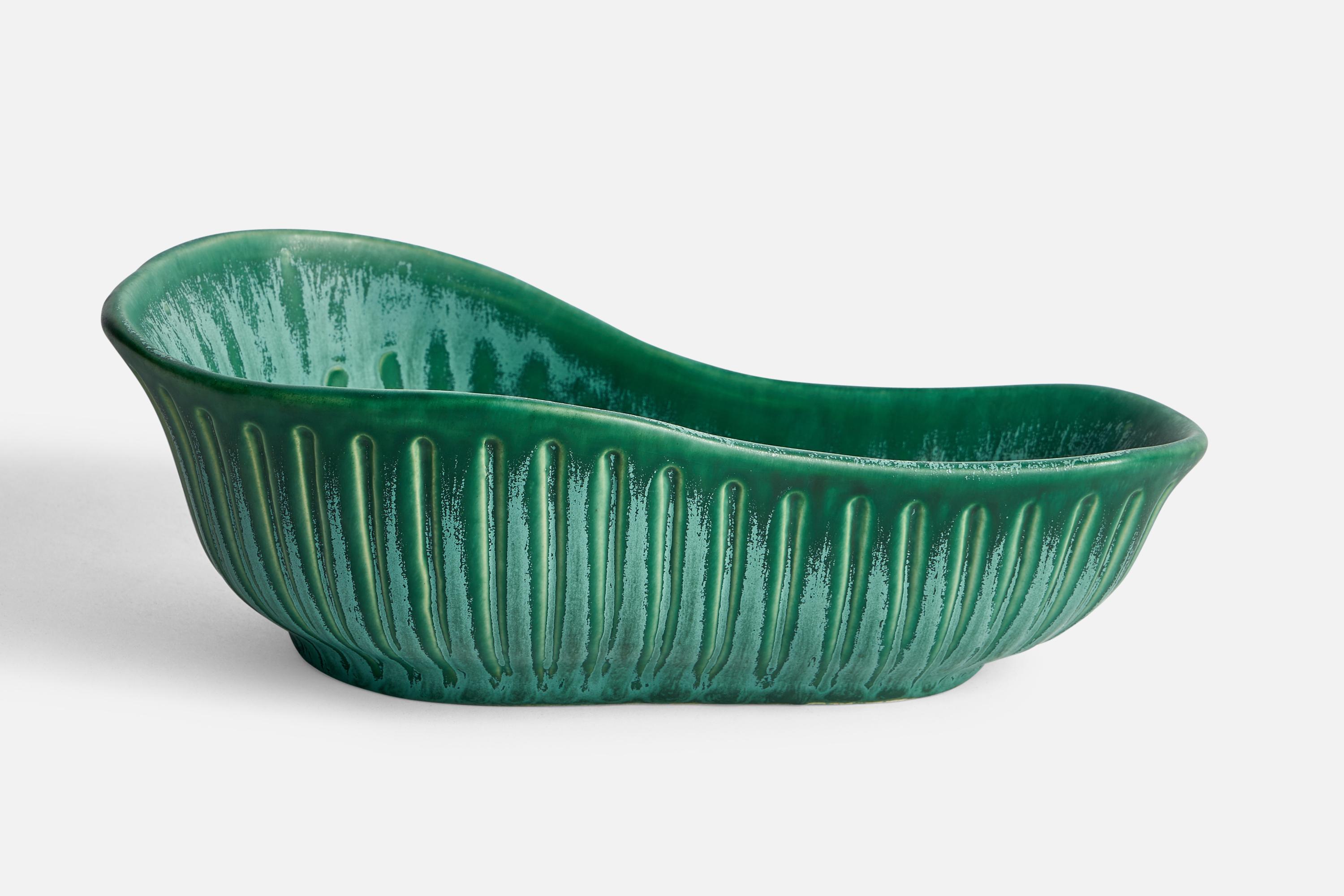 A green-glazed fluted bowl designed by Ewald Dahlskog and produced by Bo Fajans, Sweden, 1930s.