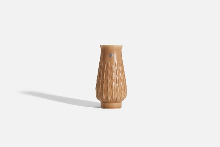 A light brown, glazed earthenware vase designed by Ewald Dahlskog and produced by Bo Fajans, Sweden, 1930s. 

