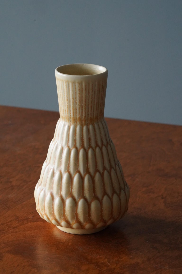 A vase. Designed by Ewald Dahlskog, produced by Bo Fajans, Sweden, 1930s. 

Marked and intialed.