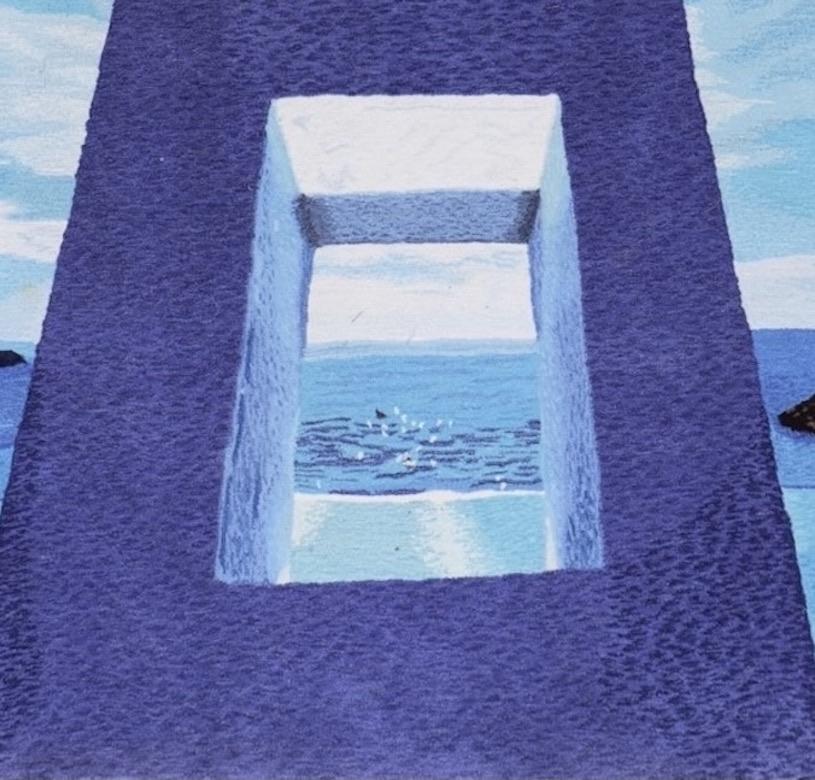 A stunning surrealist carpet or wall hanging, 1970s, designed by Ewald Kroner, with a René Magritte-style doorway in a blue seascape, signed and original label to the back.

This wonderful high-pile tapestry is a piece of art and a real statement