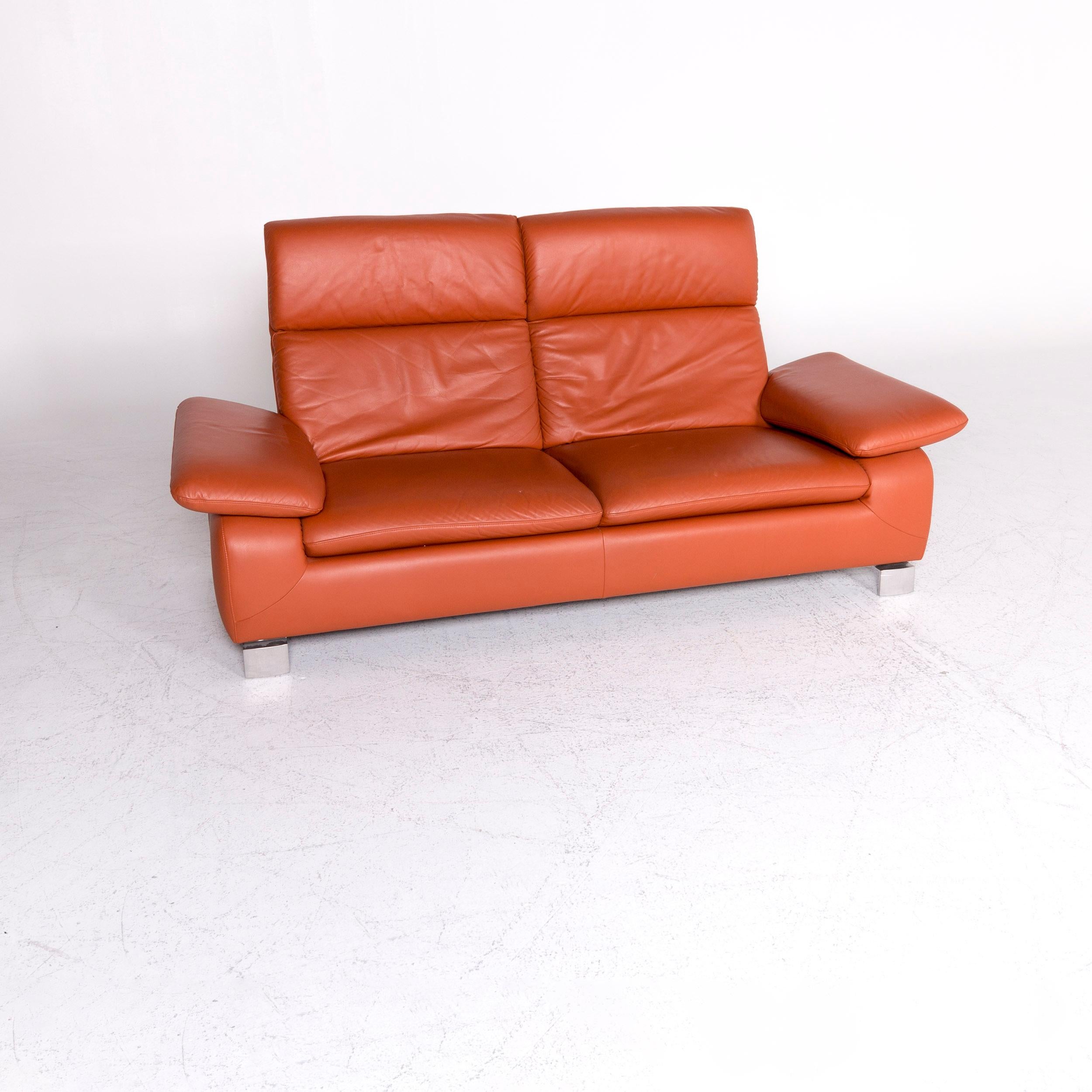 We bring to you an Ewald Schillig designer leather sofa orange three-seat couch.

Product measurements in centimeters:

Depth 88
Width 200
Height 103
Seat-height 42
Rest-height 57
Seat-depth 55
Seat-width 133
Back-height 61.
     