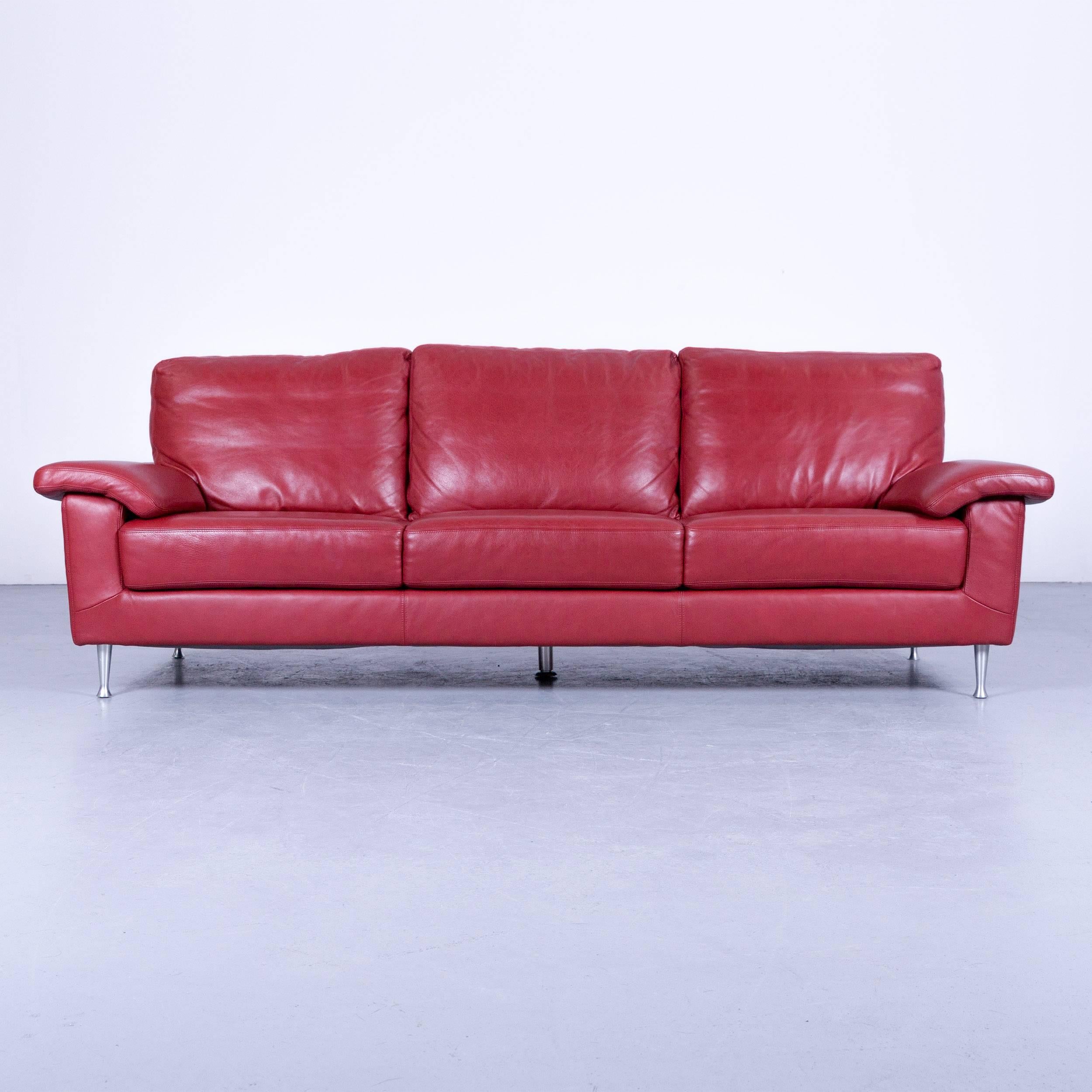 Ewald Schillig designer three-seat sofa with red leather, in a minimalistic and modern design, made for pure comfort and style.
