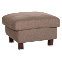 Tabouret en tissu gris-marron Ewald Schillig