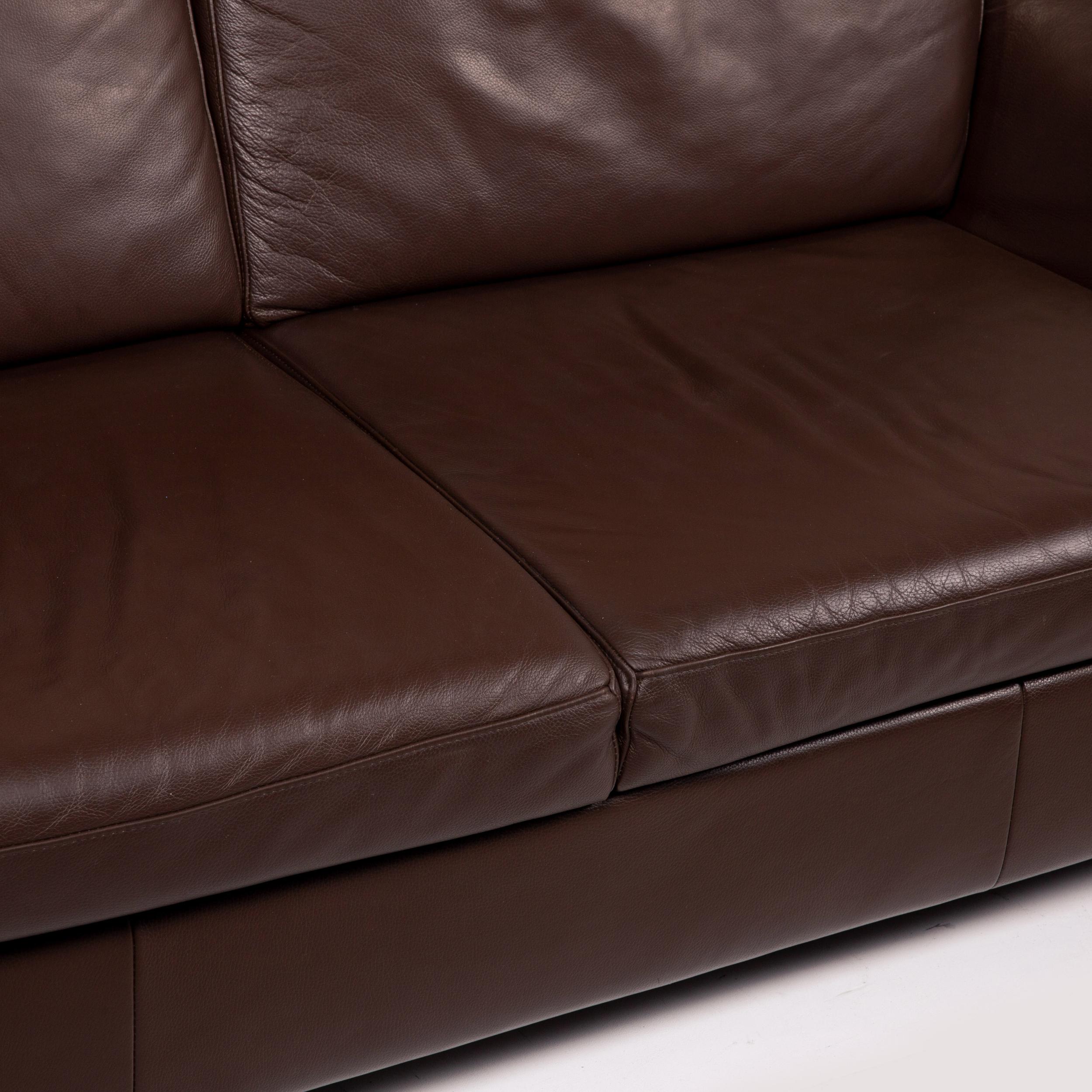 brown leather two seater sofa bed