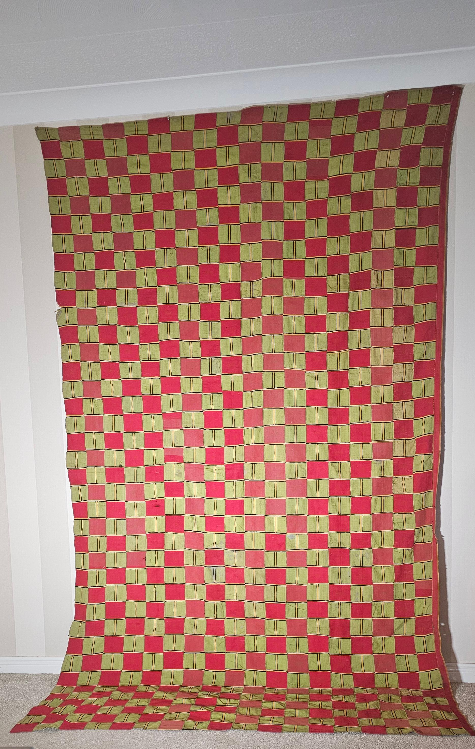 This is a very fine Example of a Chiefs Robe from the Ewe people of Western Togo. Woven from handspun cotton and all natural dyes . This piece would have been worn by a high ranking Chief  with the red tones denoting his staturs and the green hues