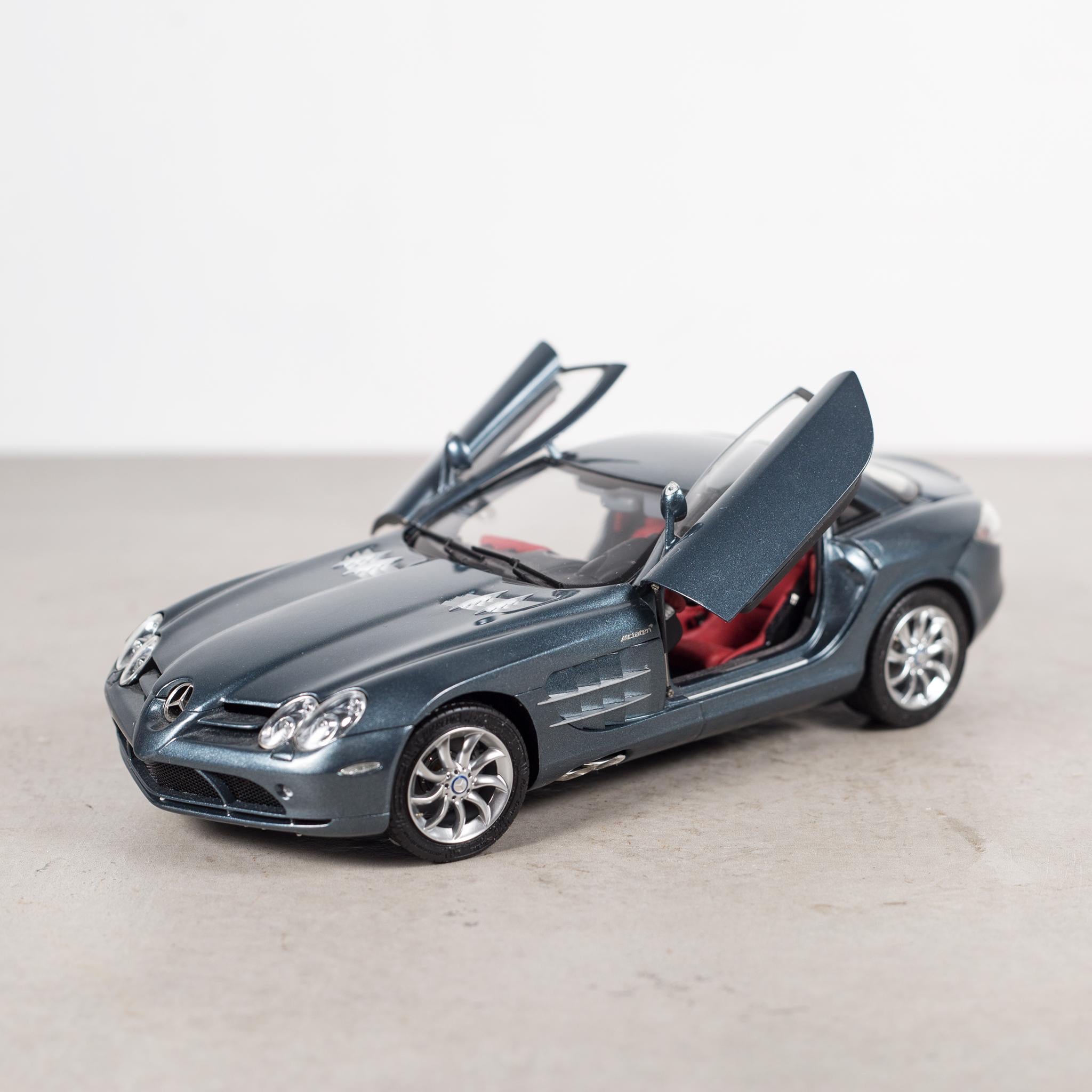 About

An exact replica of the Mecedes-Benz SLR McLaren Model. 1:18 scale. Diecast, precision metal model hand assembled. Original box.
Model details:

 Handmounted full metal model. Built of more than 895 parts
 Interior, especially for the