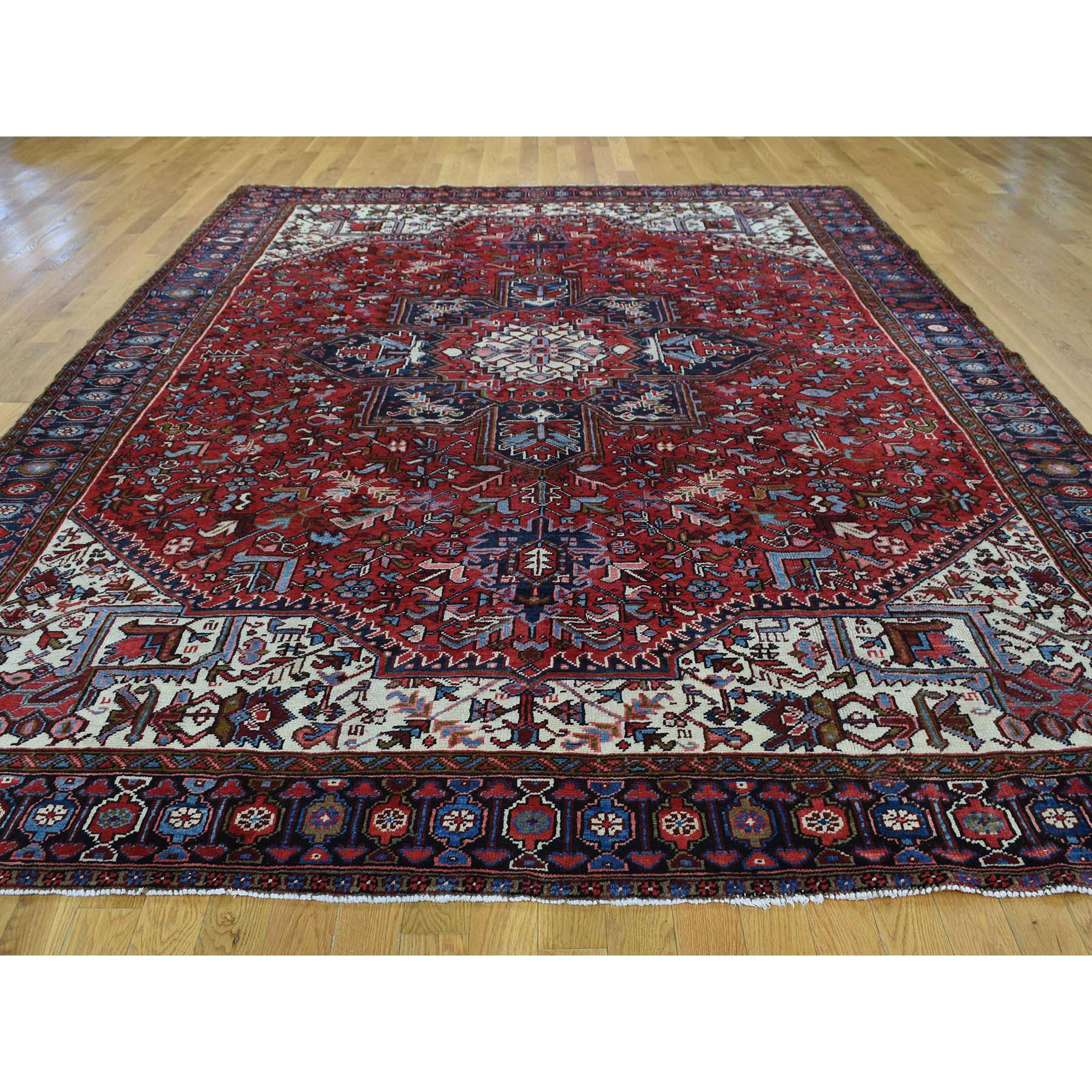 This is a truly genuine one-of-a-kind excellent condition semi antique Persian Heriz hand knotted rug. It was made in the centuries-old Persian weaving craftsmanship techniques by expert artisans. Measures: 8'2