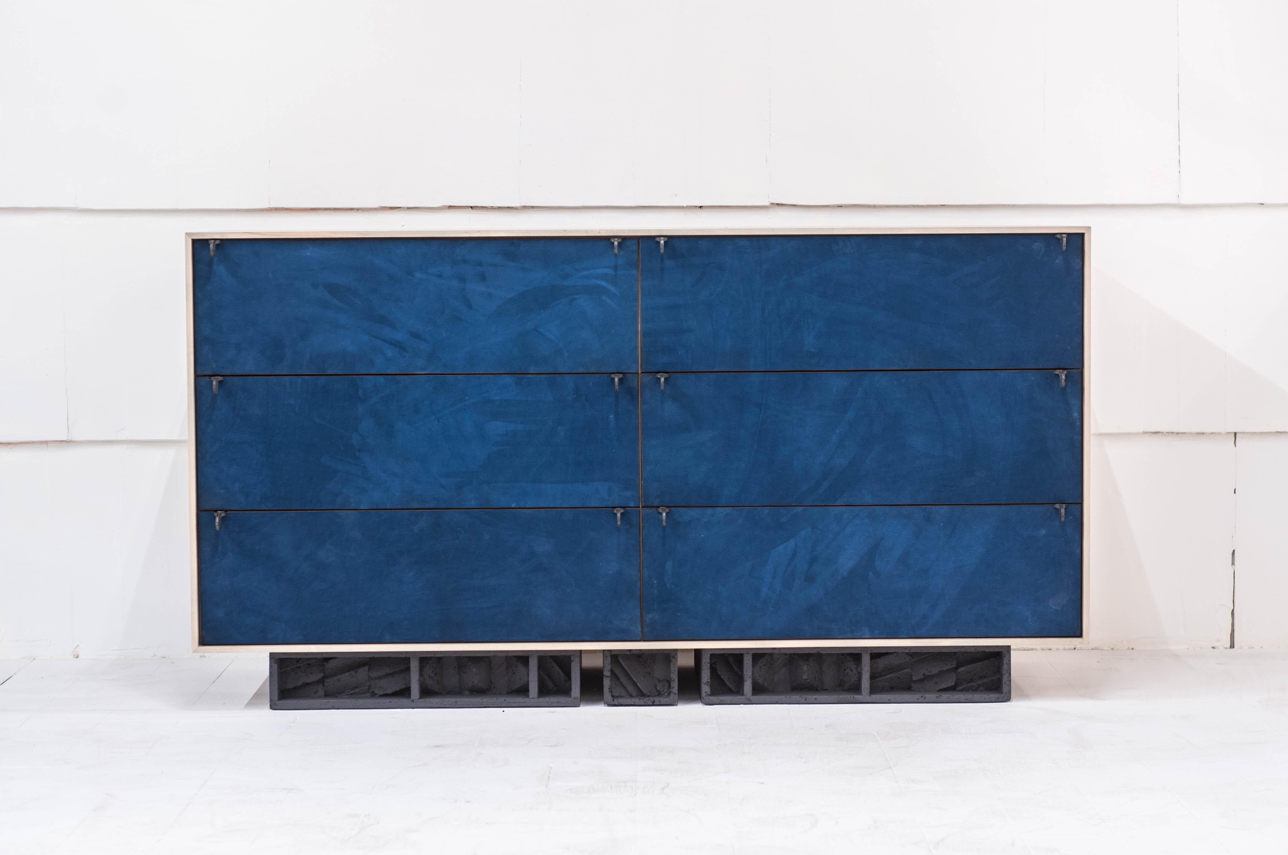 6-drawer dresser in blue suede, oxidized maple and cast pewter petal handles on a triple plinth brutalist base.