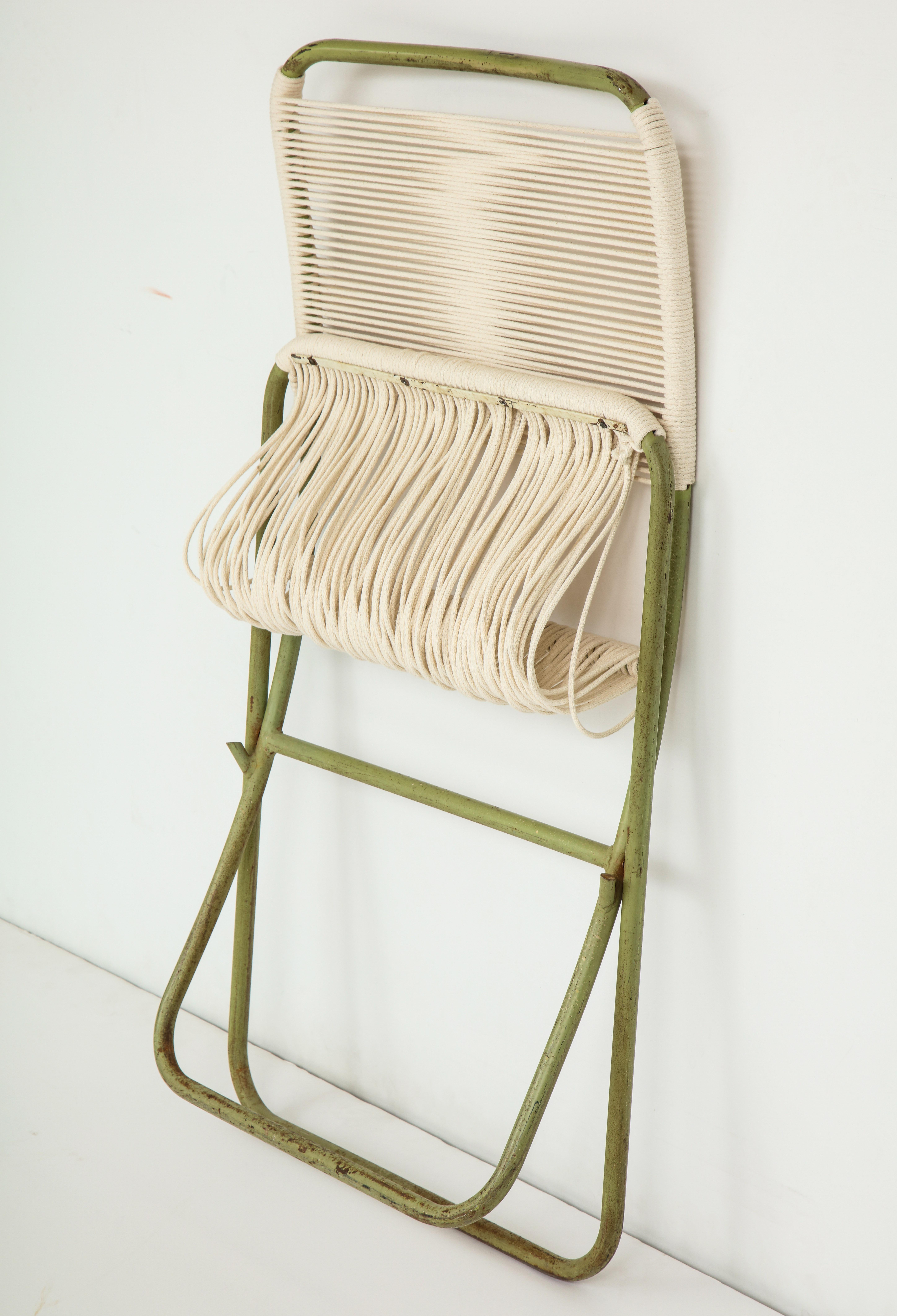 Exceedingly rare, sculpturally resonant Greta Grossman indoor/outdoor folding chairs, of painted tubular steel and cotton cord, produced in California circa 1949 either by Barker Brothers or Modern Color, Inc. The chaise and lounge versions of this