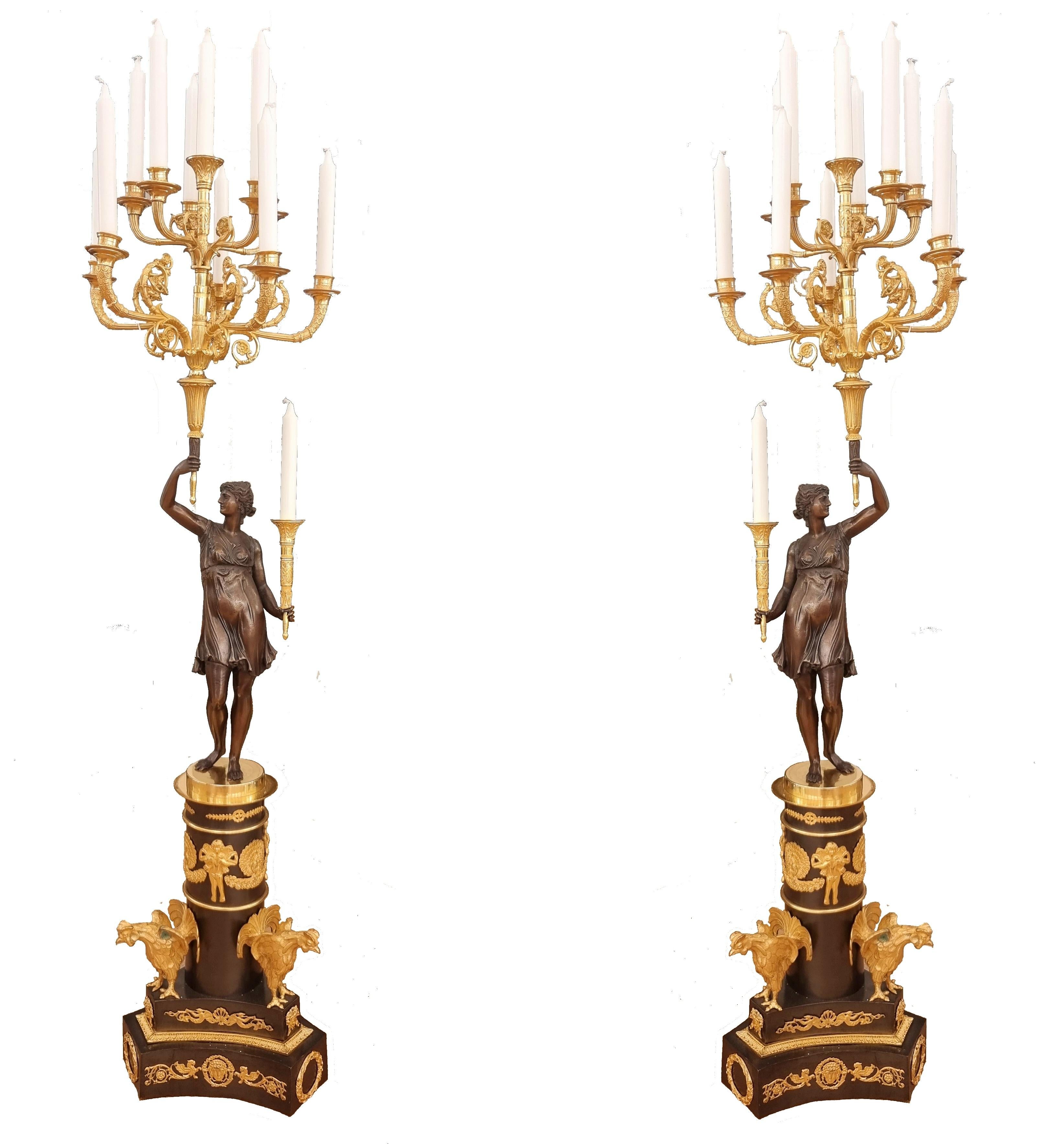 Late 19th century bronze candelabras with sixteen lights
Gilded branches held by a dark bronze lady. The tripod base holds a black column with delicate gilded bronze pieces and three beautiful birds . This pair is of exceptional condition. my