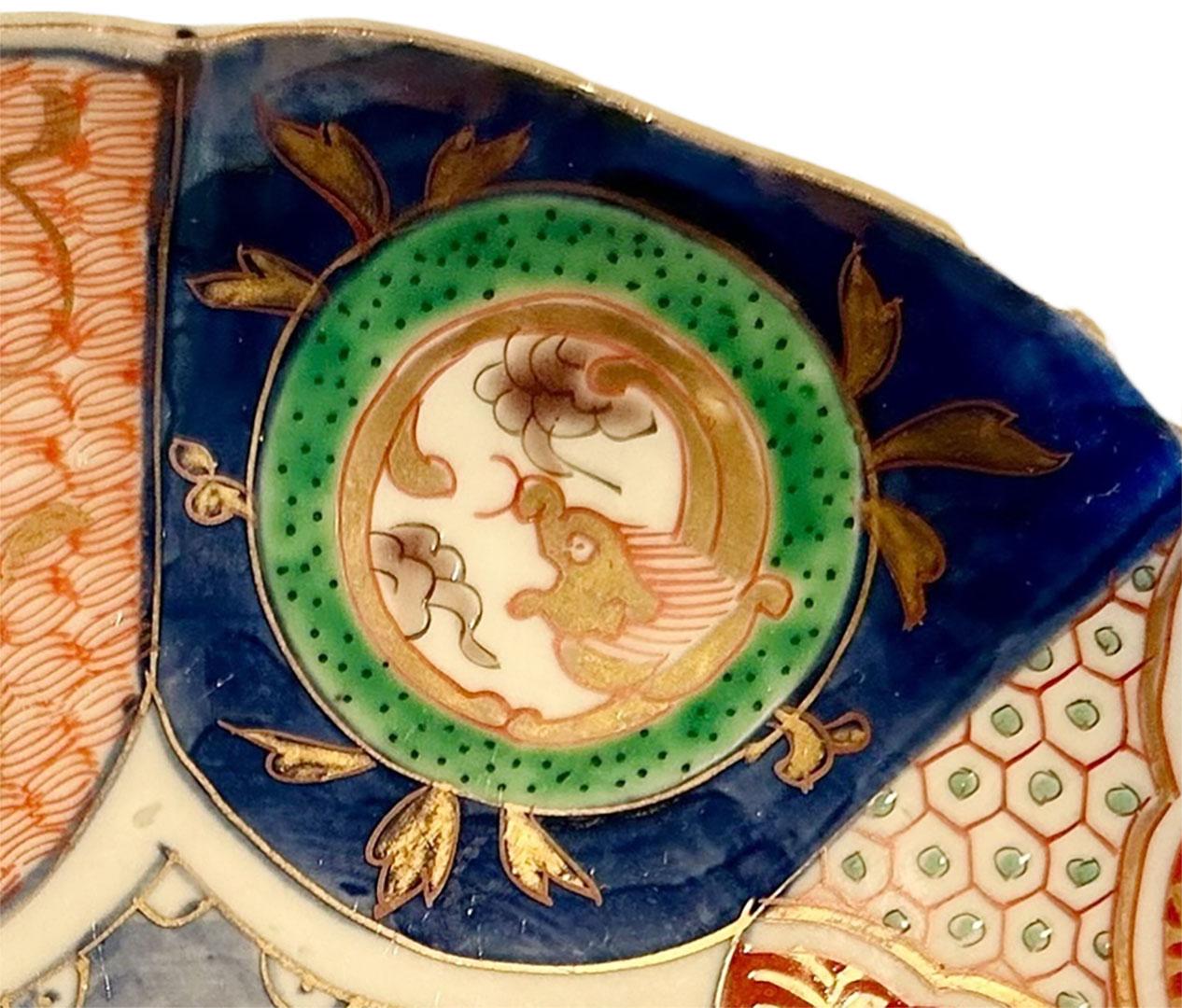 A Japanese very nicely decorated Imari plate with beautiful green and gold accents. It looks like it’s never been used.