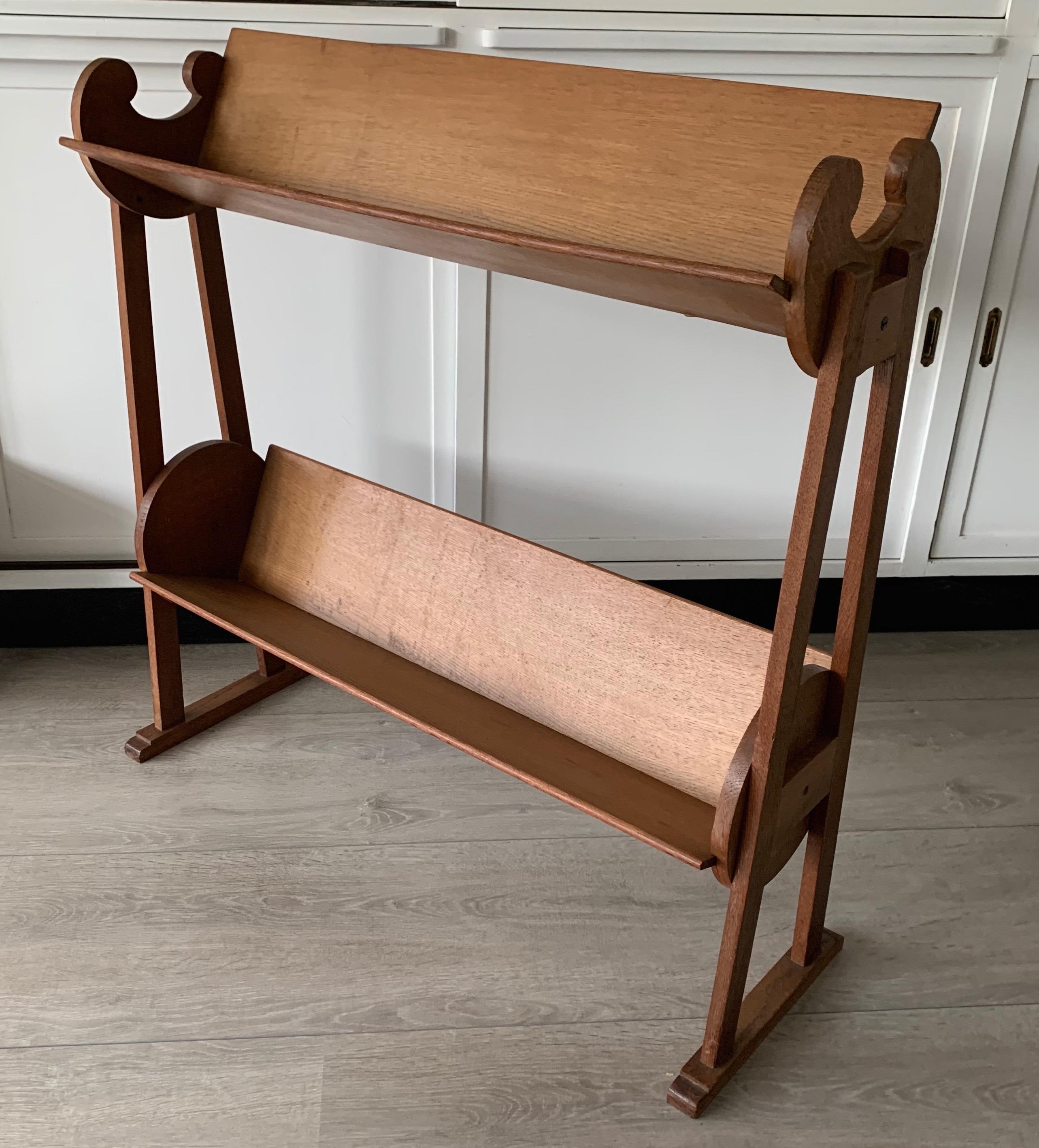 Stylish and practical antique, solid oak book stand.

This rare, two-tier bookcase could be the perfect finish to a small area for reading, rest and relaxation. However, this timeless design could also be used in an office setting for quick and
