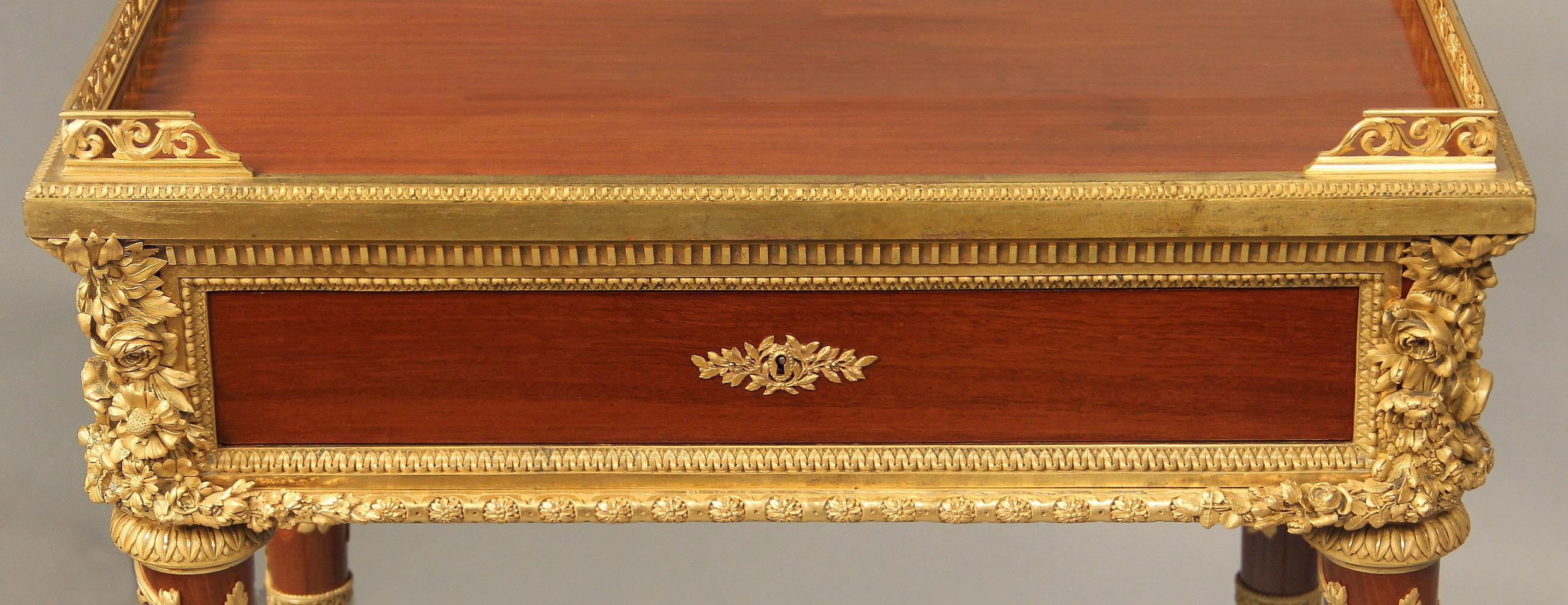 An Excellent Quality Late 19th Century Louis XVI Style Gilt Bronze Mounted Gueridon By Henry Dasson

Henry Dasson

The rectangular top with pierced three-quarter gallery, above a single frieze drawer, the sides each mounted with Minerva’s